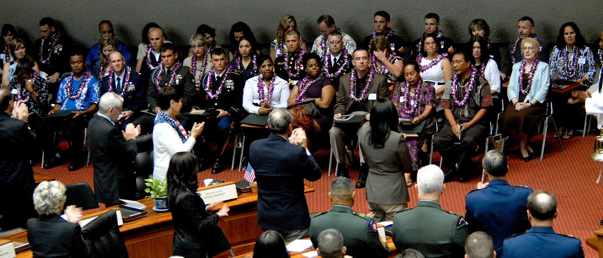 Local leaders, congressional delegates, and military members, stand and applaud the families, friends and coworkers, of 28 fallen service members being presented the Hawaii Medal of Honor posthumously, during a special ceremony at the State Capitol, Honolulu, Hawaii, March 23, 2010.  The Hawaii Medal of Honor was created in 2005 to recognize the heroism of those members of the U.S. armed forces with links to Hawaii who are killed in action while serving our country as part of Operation Iraqi Freedom and Operation Enduring Freedom in Iraq and Afghanistan. The presentation of the Hawaii Medal of Honor was the first of its kind in the nation, and has become the model for similar ceremonies in other states. (U.S. Air Force photo/Tech. Sgt. Jerome S. Tayborn)
