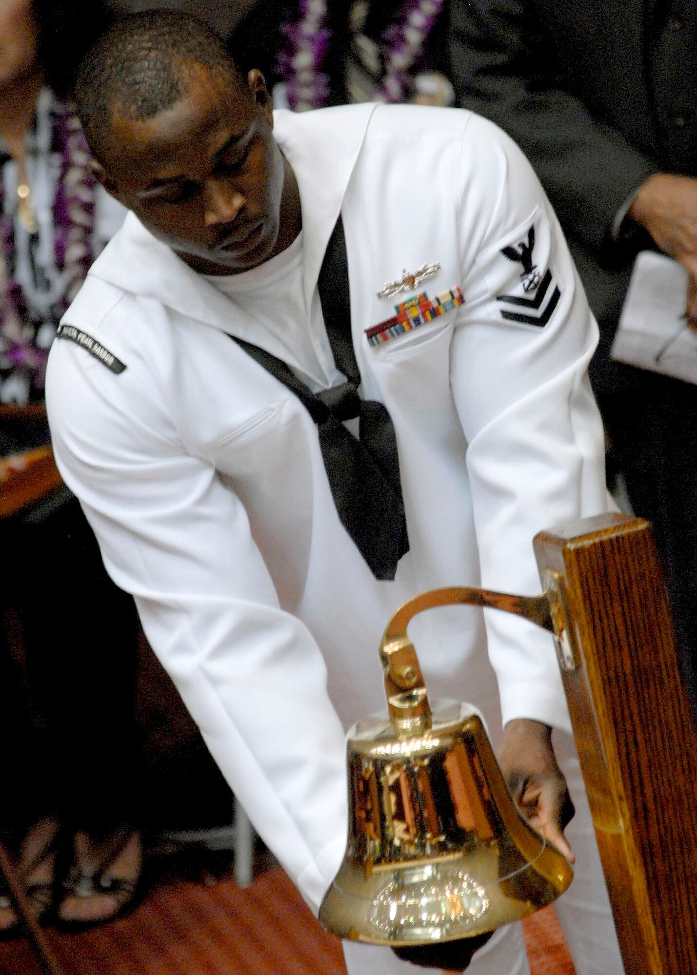 A U. S. Navy, Petty Officer Second Class, rings a bell for each the 28 fallen service members as their names were called one by one.  Each was presented the Hawaii Medal of Honor posthumously, at a special ceremony at the State Capitol, Honolulu, Hawaii, March 23, 2010.  The Hawaii Medal of Honor was created in 2005 to recognize the heroism of those members of the U.S. armed forces with links to Hawaii who are killed in action while serving our country as part of Operation Iraqi Freedom and Operation Enduring Freedom in Iraq and Afghanistan. The presentation of the Hawaii Medal of Honor was the first of its kind in the nation, and has become the model for similar ceremonies in other states. (U.S. Air Force photo/Tech. Sgt. Jerome S. Tayborn)