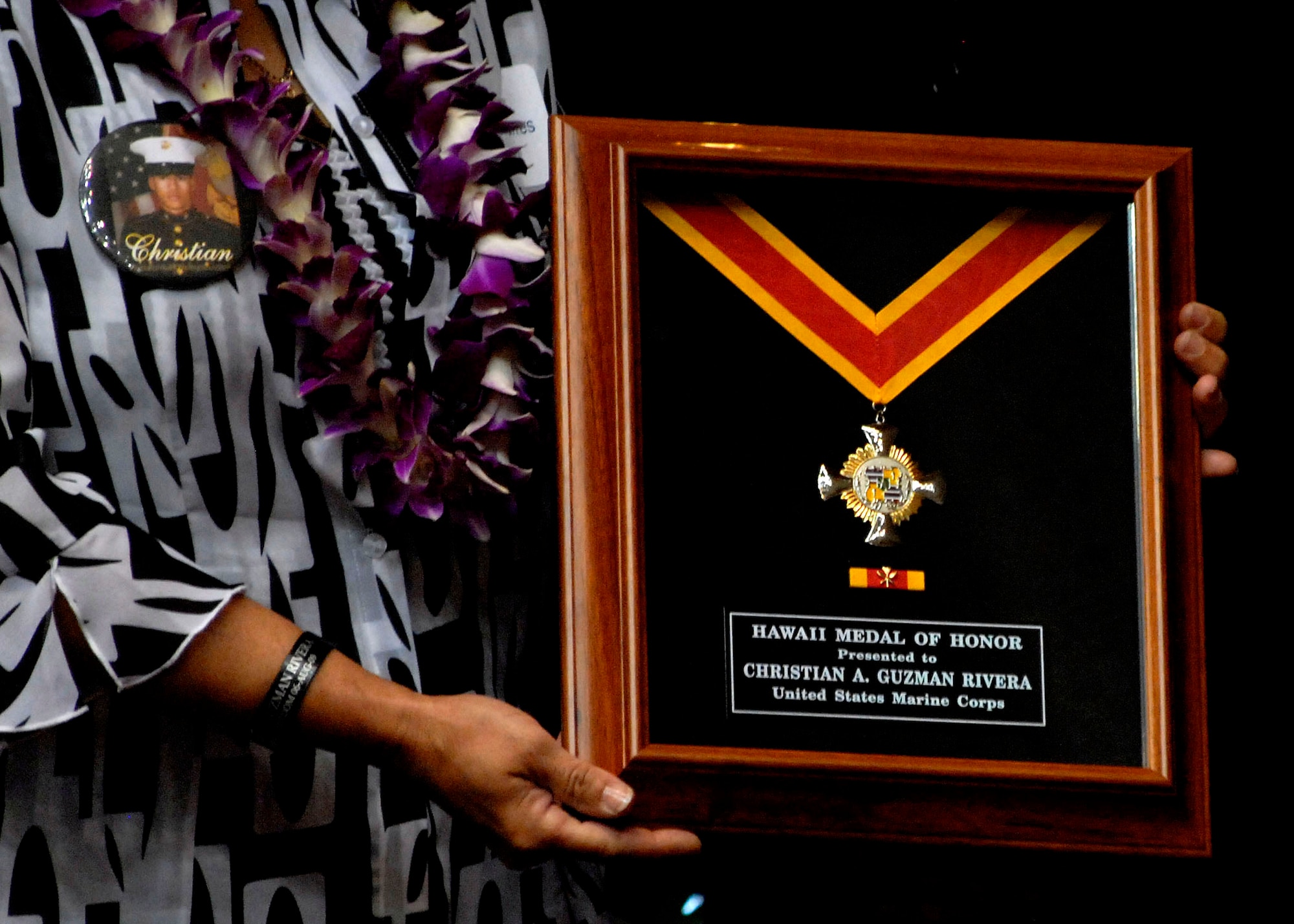 Velma Torres being presented the Hawaii Medal of Honor posthumously, on behalf of her son, United States Marine Corps Corporal Christian A. Guzman at the State Capitol, Honolulu, Hawaii, March 23, 2010.  In all, 28 recipients were posthumously awarded the Hawaii Medal of Honor. The Hawaii Medal of Honor was created in 2005 to recognize the heroism of those members of the U.S. armed forces with links to Hawaii who are killed in action while serving our country as part of Operation Iraqi Freedom and Operation Enduring Freedom in Iraq and Afghanistan. The presentation of the Hawaii Medal of Honor was the first of its kind in the nation, and has become the model for similar ceremonies in other states. (U.S. Air Force photo/Tech. Sgt. Jerome S. Tayborn)
