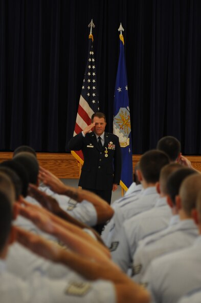 Lt. Col. Kenneth Hall, outgoing commander of the 48th Intelligence Squadron, receives his final salute March 26 at the Community Activities Center. Col. Hall served at the Distributed Grounds System one and two as a mission operations commander and DGS-3 as the chief of intelligence systems. (Air Force photo by Senior Airman Christopher Ruano)