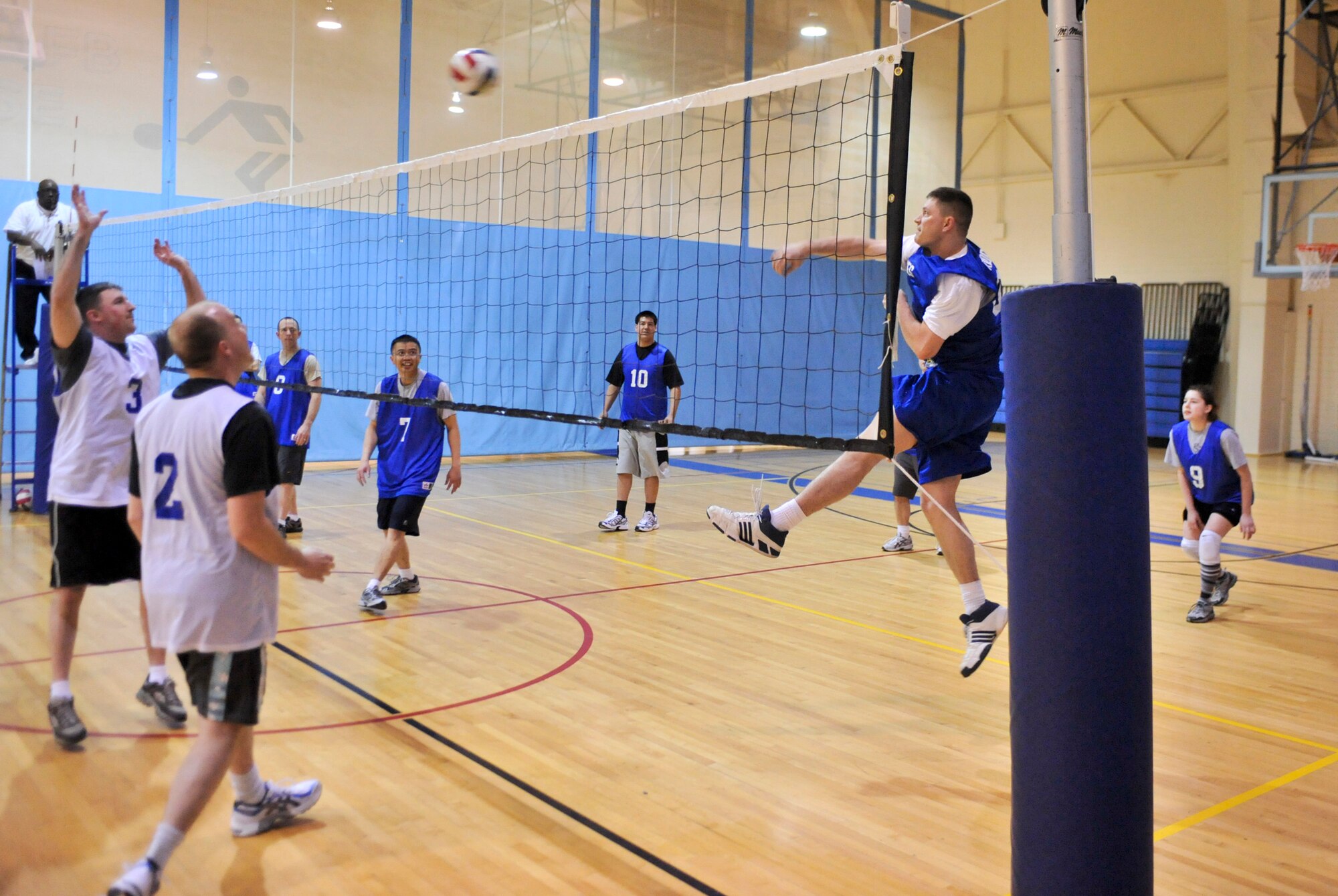 ELMENDORF AIR FORCE BASE, Alaska – Timothy Riddle, 3rd Civil Engineer Squadron, spikes the ball over the top of a few 3rd Communication Squadron players, during a game of intramural volleyball March 24. The first set played between the two teams was close with the 3rd CS winning 25-23. However, the second game wasn’t as close with the 3rd CS clobbering the 3rd CES with the score of 25-13, to win the game. (Air Force photo by Airman 1st Class Christopher Gross)