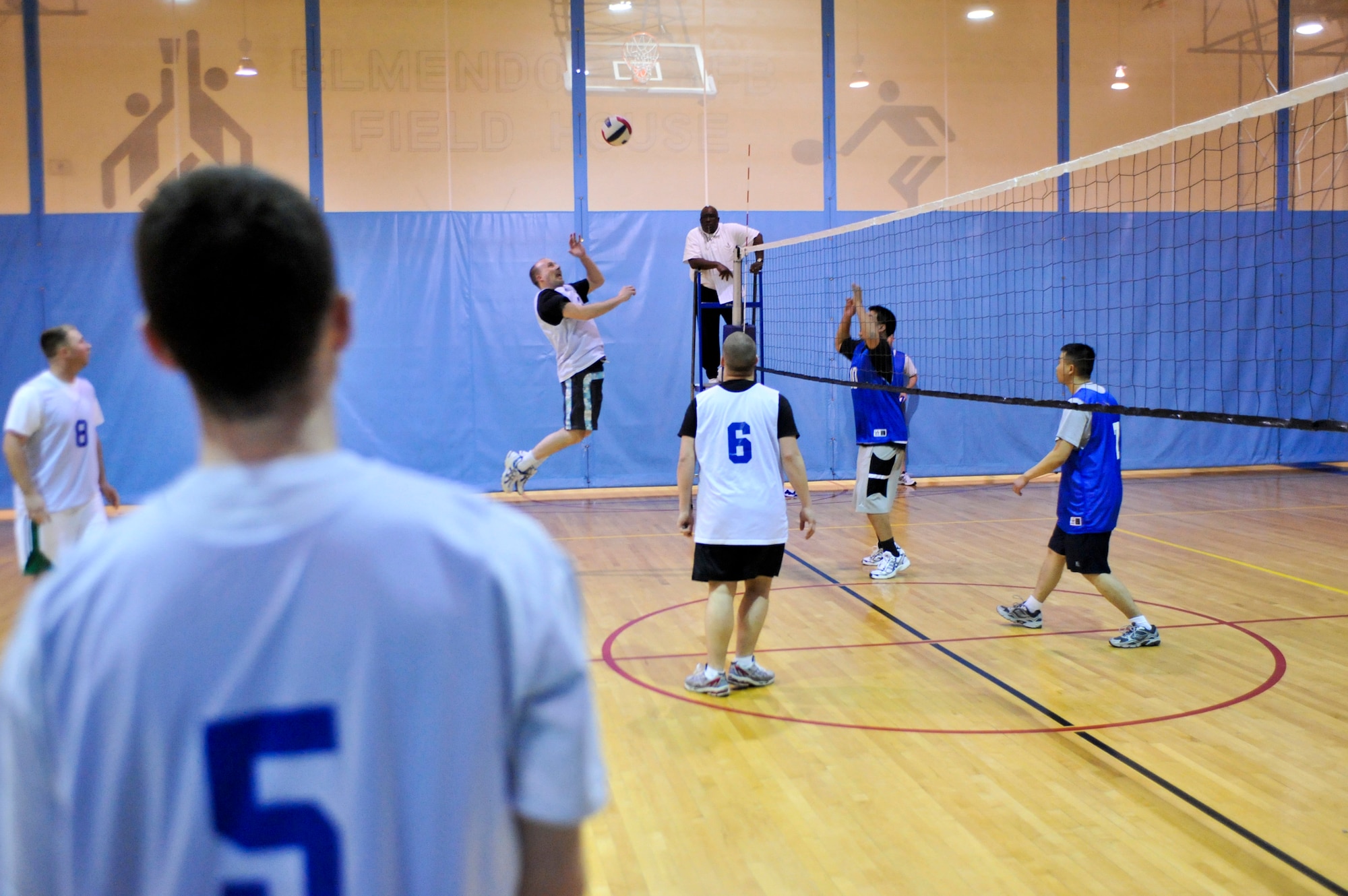 ELMENDORF AIR FORCE BASE, Alaska – Jon Larkin,  3rd Communications Squadron, gets ready to smack the ball across the net to members of the 3rd Civil Engineer Squadron during a game of intramural volleyball March 24, against the 3rd Communications Squadron. The first set played between the two teams was close with the 3rd CS winning 25-23. However, the second game wasn’t as close with the 3rd CS clobbering the 3rd CES with the score of 25-13, to win the game. (Air Force photo by Airman 1st Class Christopher Gross)