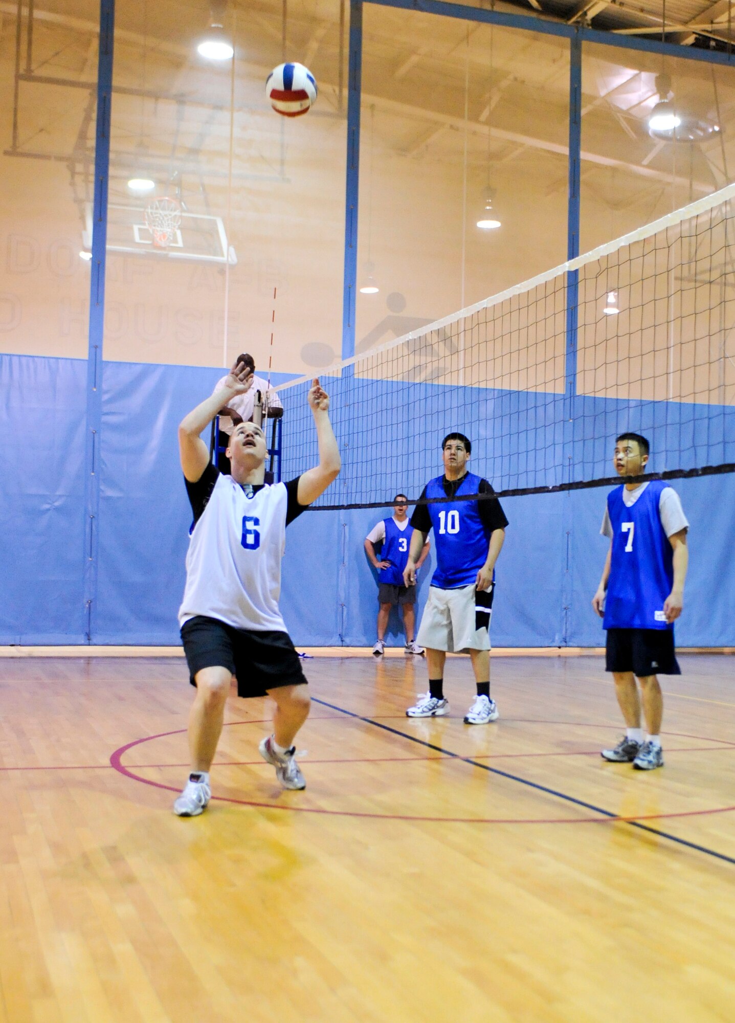 ELMENDORF AIR FORCE BASE, Alaska -- William Welsh, 3rd Communications Squadron, sets the ball during a game of intramural volleyball against the 3rd Civil Engineer Squadron March 24, against the 3rd Communications Squadron. The first set played between the two teams was close with the 3rd CS winning 25-23. However, the second game wasn’t as close with the 3rd CS clobbering the 3rd CES with the score of 25-13, to win the game. (Air Force photo by Airman 1st Class Christopher Gross)