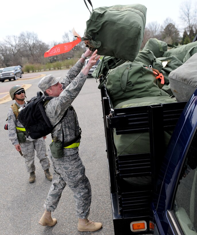 LANGLEY AIR FORCE BASE, Va. -- Master Sgt. Michael Gregory, 1st Aircraft Maintenance Squadron, loads mobility bags as he prepares to process the deployment line during the Phase I Operational Readiness Exercise here March 25. Wing Exercise Evaluation Team members spent two days assessing the ability of Langley Airmen to deploy cargo, aircraft and Airmen within a limited timeframe. (U.S. Air Force photo/Airman Rebecca Montez)