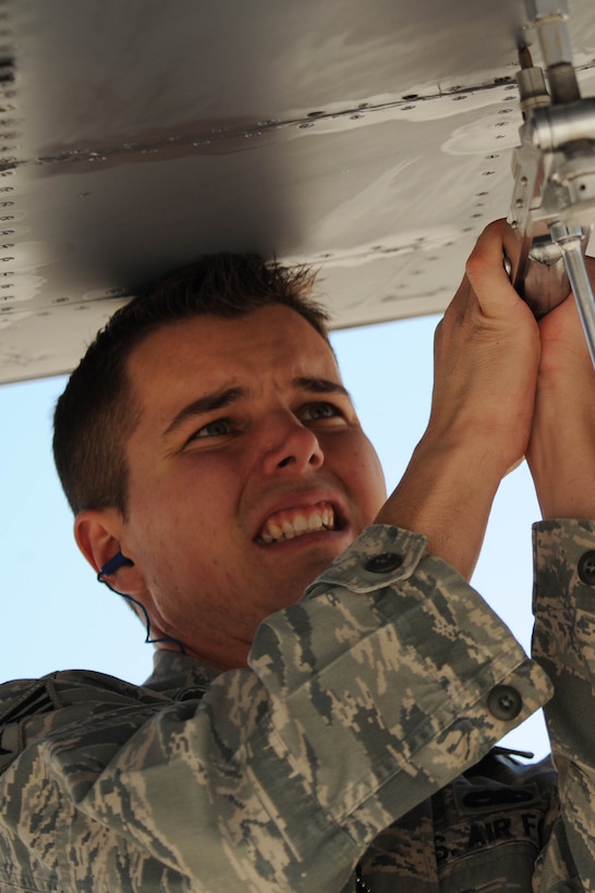 ELLSWORTH AIR FORCE BASE, S.D.,-- Senior Airman Matthew Brink, 28th Maintenance Squadron aircraft fuel systems journeyman, removes a B-1B Lancer dump panel in order to provide maintenance on internal components, March 25, 2010. The 28th Maintenance Squadron provides on and off equipment repair and maintenance support for 26 B-1B Lancers. (U.S. Air Force photo/Airman 1st Class Corey Hook) 