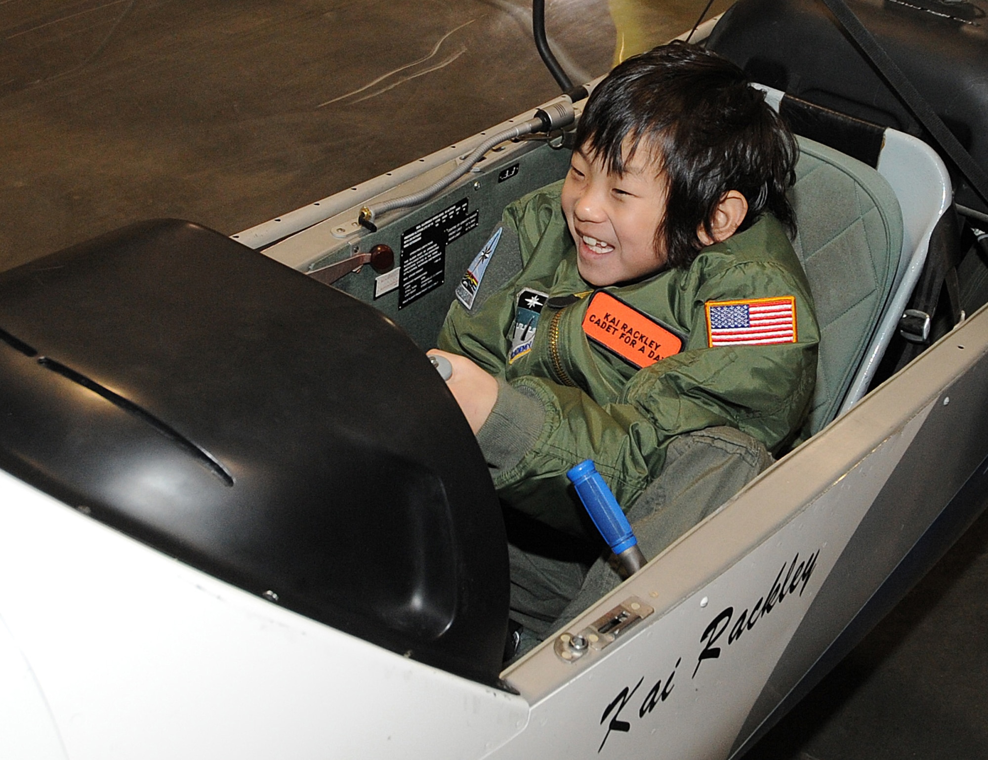 Cadet for a Day Kai Rackley checks out the controls of a glider at the U.S. Air Force Academy's airfield March 5, 2010. High winds grounded the flight, but Kai, 10, later got to sit at the controls of a flight simulator. Cadet Squadron 12 hosted Kai and his family for the two-day visit March 4-5. The Cadet for a Day program is sponsored by the Make-A-Wish Foundation. (U.S. Air Force photo/Rachel Boettcher)