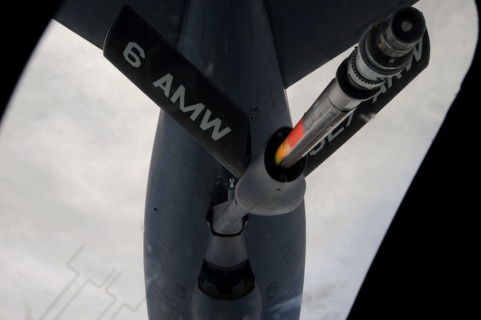 A MacDill AFB, Fla., KC-135 Stratotanker refuels a Charleston C-17 Globemaster III March 9, 2010. Aircrews of both airlifters and tankers perform regular training to execute the tedious task of mating the two machines from thousands of feet up in the air, where one crew serves as a lifeline to the other. (U.S. Air Force photo/Tech. Sgt. Dennis Henry)