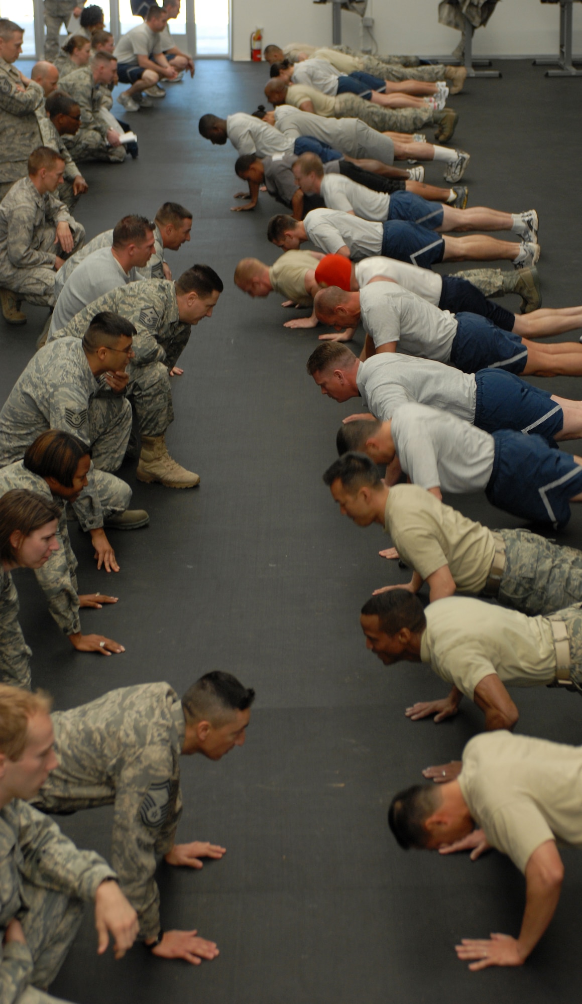 Luke Air Force Base Airmen gathered to raise money March 11 for the 2010 Days of Remembrance in a push-up competition at the Combat PT Center. Competitors had to do as many push-ups as possible in two minutes. (Photo by Airman 1st Class Sandra Welch)