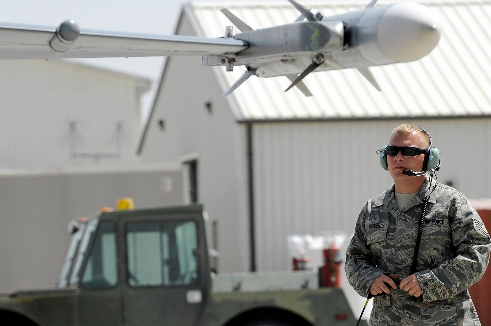 Staff Sgt. Lucas Inboden, a crew chief from the 34th Expeditionary Fighter Squadron at Bagram Airfield, Afghanistan, recovers an F-16 Fighting Falcon March 23, 2010, after it completed its 30th code 1 flight, meaning no maintenance write-ups for 30 flights in a row.  Sergeant Inboden is deployed from Hill Air Force Base, Utah.  (U.S. Air Force photo/Tech. Sgt. Jeromy K. Cross)