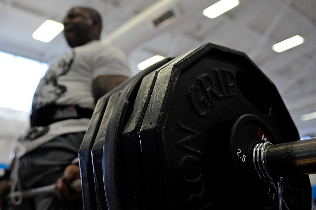 ELLSWORTH AIR FORCE BASE, S.D. -- Staff Sgt. Tywone Weston, 28th Maintenance Squadron jet engine mechanic, executes a dead lift during the Bellamy Fitness Center powerhouse competition, March 25. Sergeant Weston was able to dead lift a maximum weight of 500 pounds. (U.S. Air Force photo/Airman 1st Class Matthew Flynn)