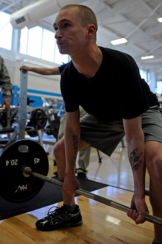 ELLSWORTH AIR FORCE BASE, S.D. -- Senior Airman David Bailey, 28th Force Support Squadron installation personnel readiness journeyman, performs a dead lift during the Bellamy Fitness Center powerhouse competition, March 25. All of the contestants were given three chances to lift their maximum weight in the three different events. (U.S. Air Force photo/Airman 1st Class Matthew Flynn)