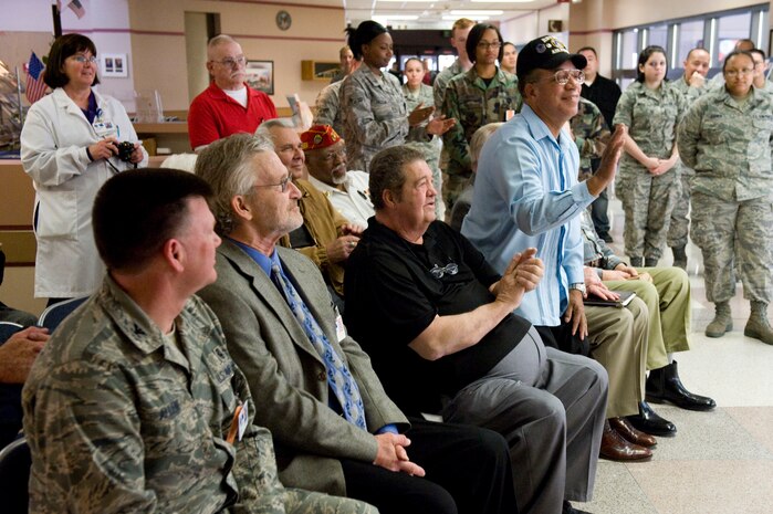 NELLIS AIR FORCE BASE, NEV.-- Members of the group Patches are introduced at Mike O' Callahan Federal Hospital before the presentation of a collage made by the group to recognize all veterans and active duty servicemembers of the United States military. Patches creates collages for military members, children's hospitals and other organizations. All of the work done by Patches is made possible through donations, which usually come from veterans and their families. (U.S. Air Force Photo / Airman 1st Class Jamie Nicley)