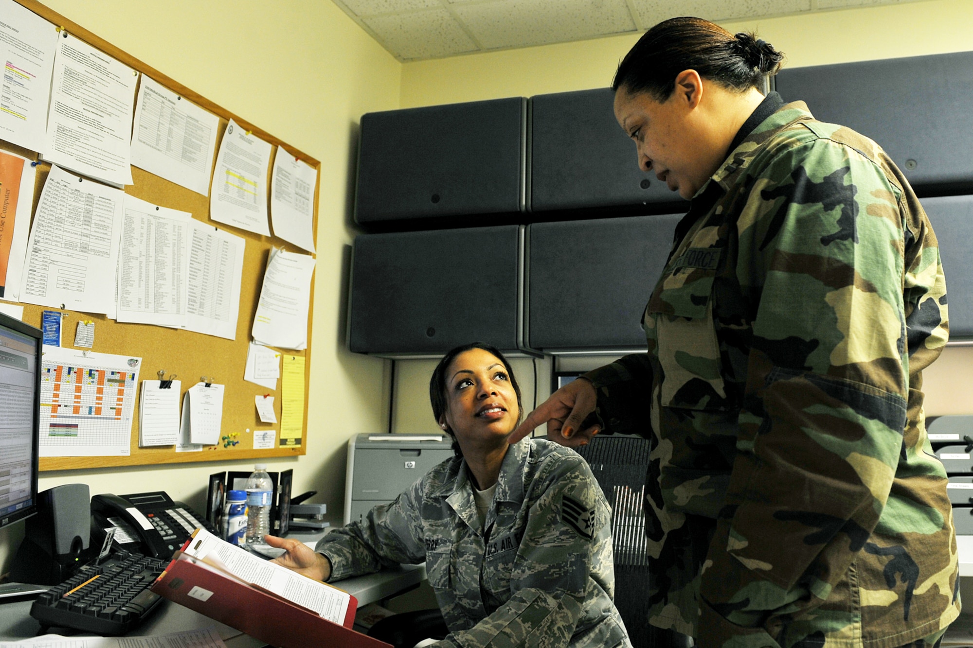 OFFUTT AIR FORCE BASE, Neb. -- Staff Sgt. Andrea Perry, a medical technician with the 55th Medical Operations Squadron, receives tips from Capt. Felisa Wilson, a group practice manager also with the 55th MOS, on ways to improve her Airman's enlisted performance report at the Ehrling Bergquist Clinic here March 25. Captain Wilson as an avid volunteer in the community and is involved with a number of organizations including, the Drug Education for Youth program and Offutt's Company Grade Officer's Council, where she serves as the president. U.S. Air Force photo by Charles Haymond