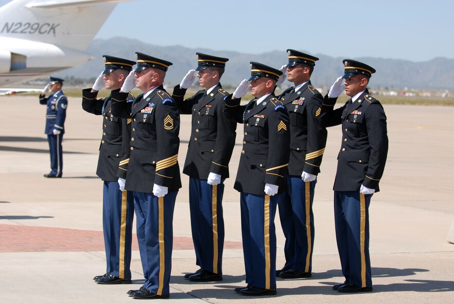 Members of the Arizona National Guard render a final salute to U.S. Army Sgt. 1st Class Glen Jacob Whetten, during a dignified transfer ceremony at Luke Air Force Base, Ariz. on Mar. 19. Sergeant Whetten was killed on Mar. 12 after the vehicle he was traveling in was struck by an improvised explosive device near Kandahar, Afghanistan. Approximately 300 members of Luke attended the ceremony. (U.S. Air Force photo by Airman 1st Class Sandra Welch) 