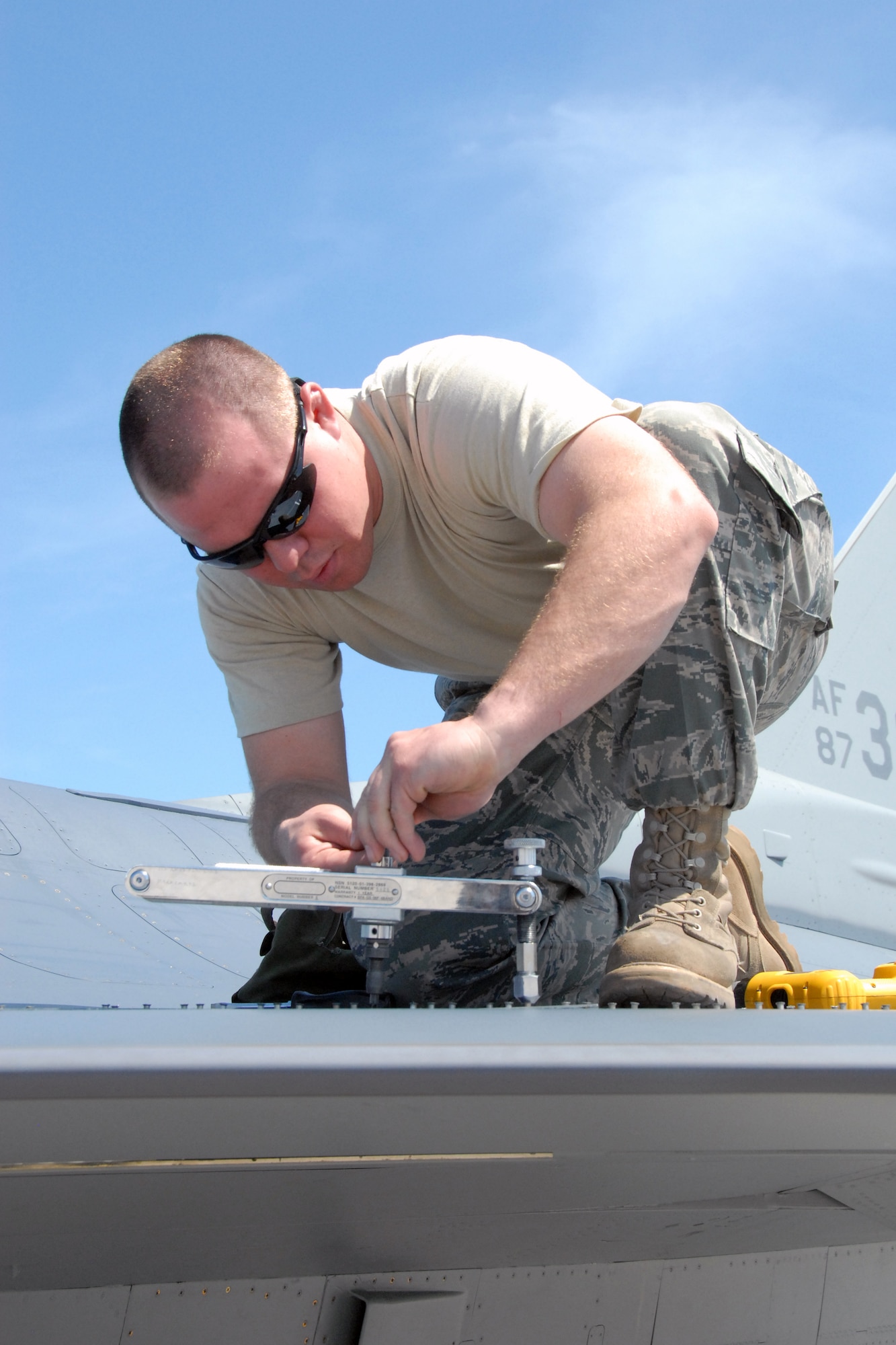 Airman 1st Class Jacob Lehr, a member of the 115 th Fighter Wing’s aircraft structural maintenance shop, works on an F-16C Fighting Falcon March 23, 2010, as part of two week air-to-air combat skills training mission at Naval Air Station Key West, Fla.   Close to 145 Airmen of the 115th Fighter Wing in Madison, Wis., spent approximately two weeks at NAS, gaining valuable training as their F-16 Falcons sparred against Navy F-18 Super Hornets and F-5 Tigers here.  (U.S. Air Force photo by Airman 1st Class Ryan Roth, 115 FW/PA)