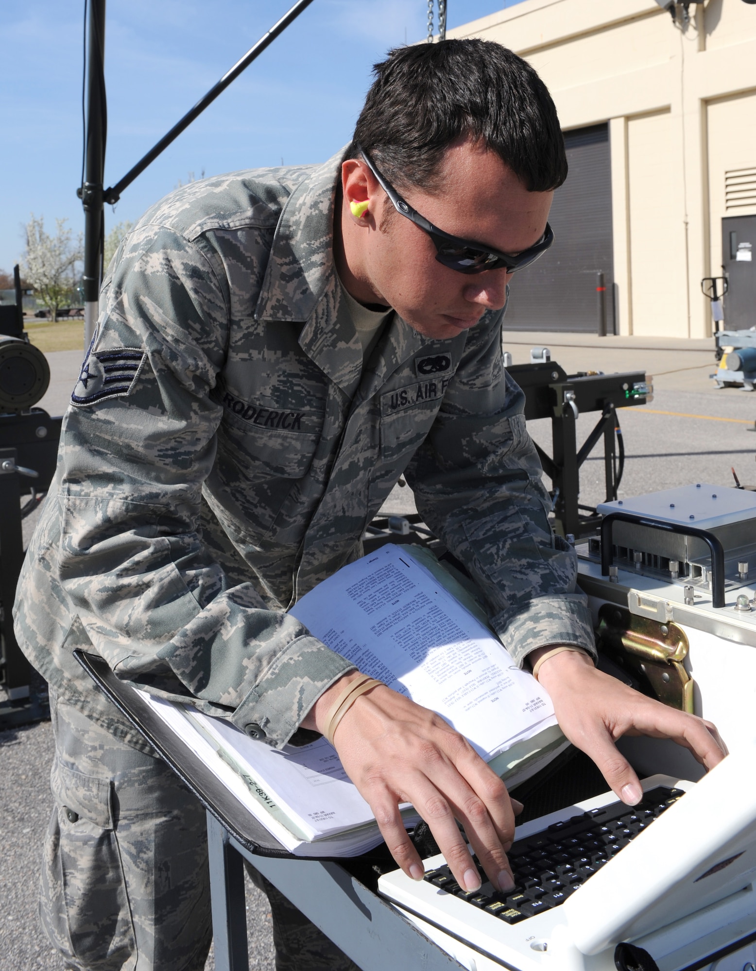 Staff Sgt. Brett Roderick, 4th Equipment Maintenance Squadron conventional maintenance technician, uses his laptop to test fins from a GBU-38 training bomb during a bomb build on Seymour Johnson Air Force Base, N.C., March 24, 2010. Roderick tests the fins for cracks or wear and tear before attaching them to a bomb unit. Roderick hails from Tampa Bay, Fla. (U.S. Air Force photo/Airman 1st Class Gino Reyes)