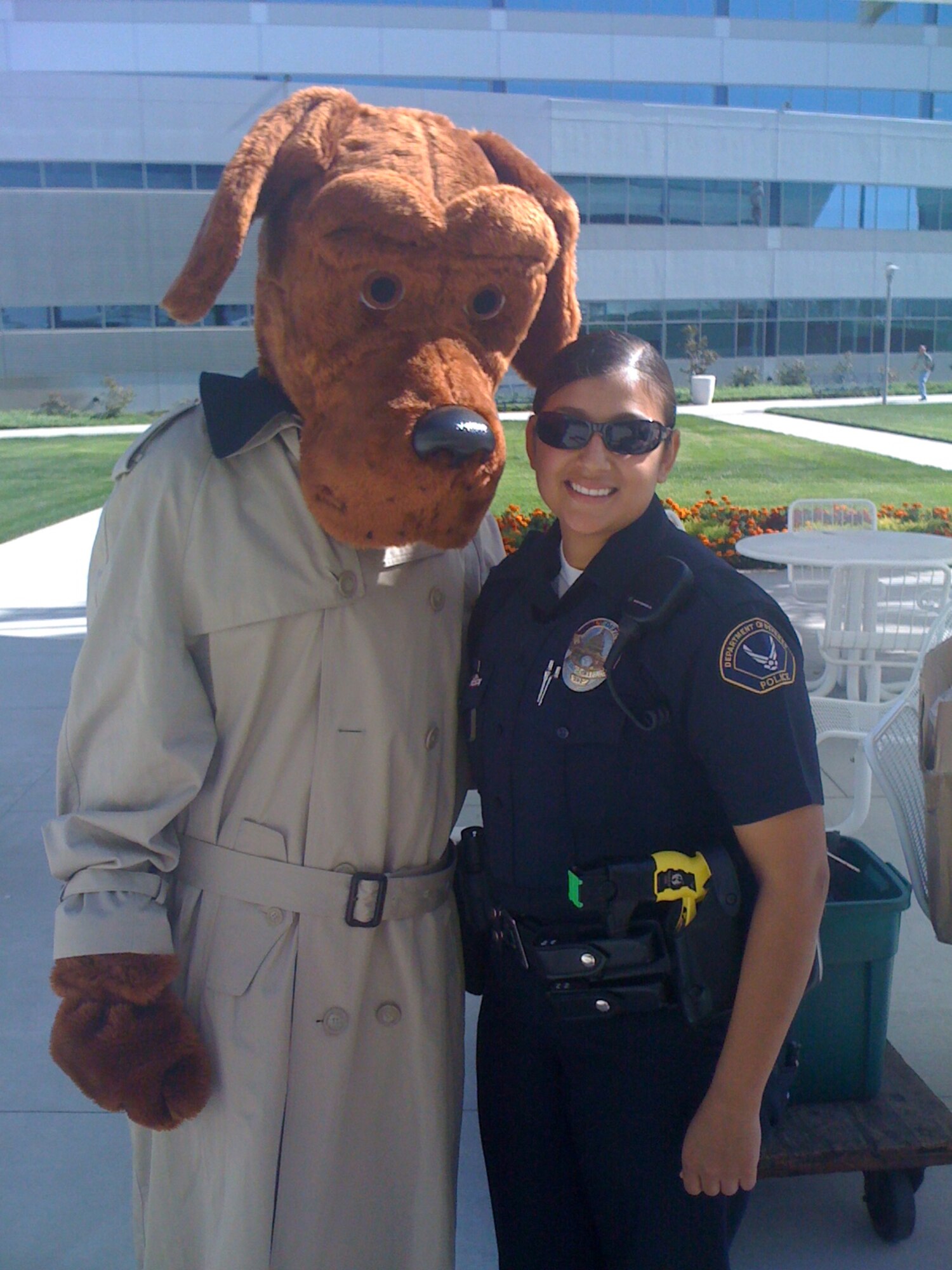 DOD Police Officer Yvette Perez poses with McGruff the Crime Dog. (Courtesy photo)