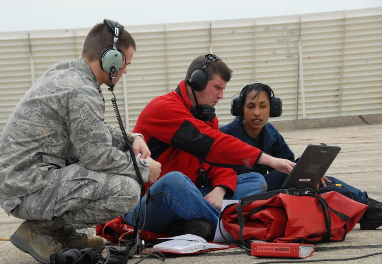 EGLIN AIR FORCE BASE, Fla. -- Test engineers check the laptop prior to a ground test of the A-10C Thunderbolt II March 24 prior to the groundbreaking flight powered solely on a biomass-derived jet fuel blend. The A-10 was fueled with a 50/50 blend of Hydrotreated Renewable Jet and JP-8.  (U.S. Air Force photo/Samuel King Jr.)