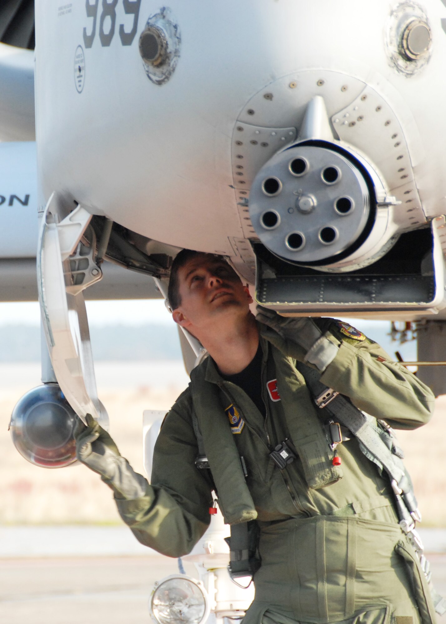 EGLIN AIR FORCE BASE, Fla. -- Maj. Chris Seager, 40th Flight Test Squadron test pilot, performs pre-flight checks on the A-10C Thunderbolt II as it prepares for the first flight of an aircraft powered solely on a biomass-derived jet fuel blend. The A-10 was fueled with a 50/50 blend of Hydrotreated Renewable Jet and JP-8.  The flight took place here March 25.  (U.S. Air Force photo/Samuel King Jr.)