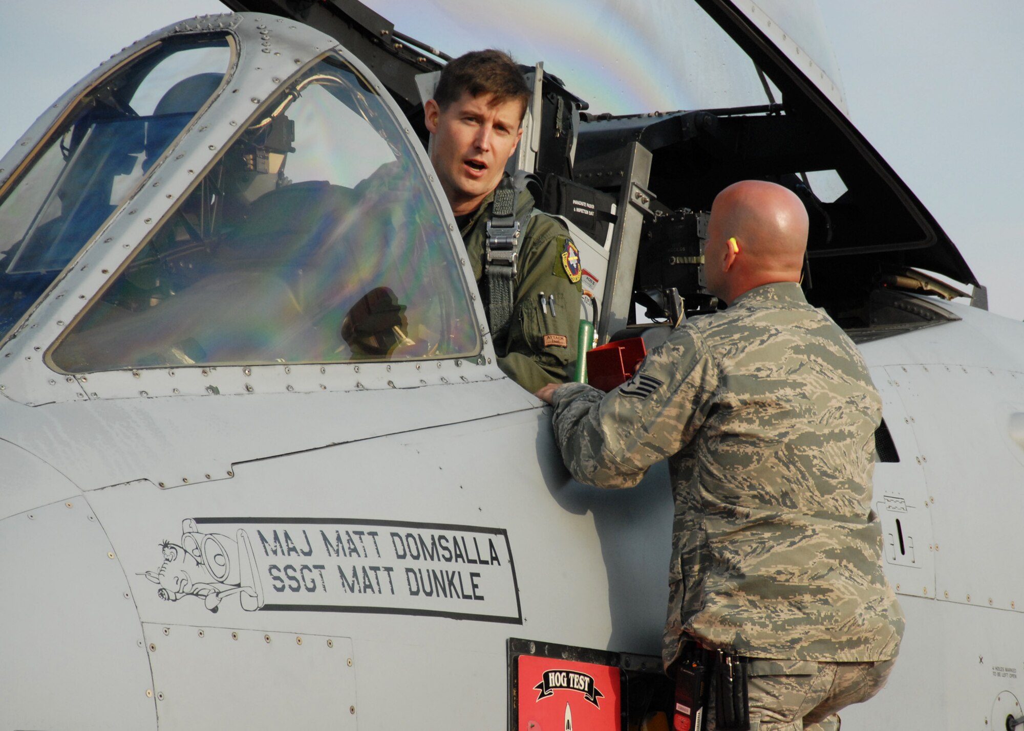 EGLIN AIR FORCE BASE, Fla. -- Maj. Chris Seager, 40th Flight Test Squadron test pilot, talks with Staff Sgt. Rusty Jones, crew chief, as he performs pre-flight checks on the A-10C Thunderbolt II as it prepares for the first flight of an aircraft powered solely on a biomass-derived jet fuel blend. The A-10 was fueled with a 50/50 blend of Hydrotreated Renewable Jet and JP-8.  (U.S. Air Force photo/Samuel King Jr.)