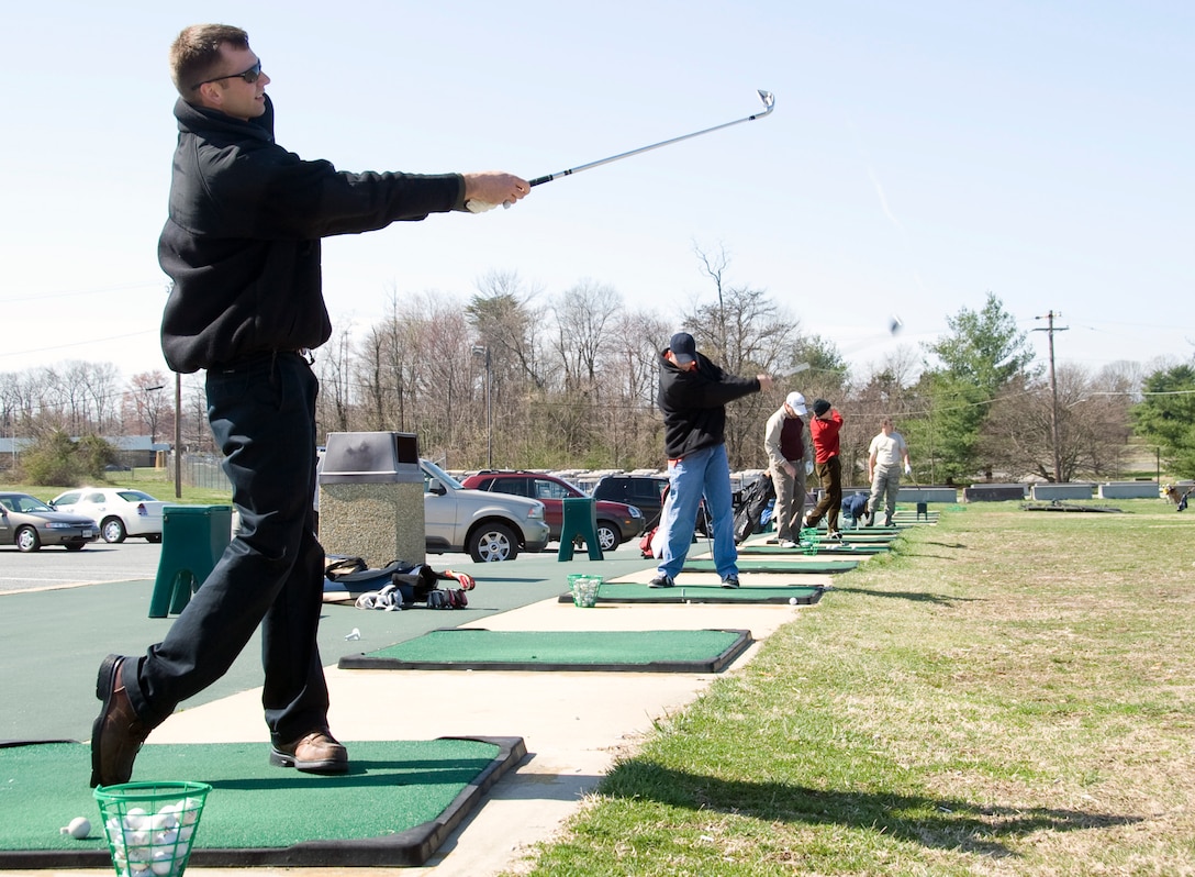 Michael Mullins, 459th Air Refueling Wing quality assurance inspector, uses an 8-iron on the driving range at The Courses at Andrews at Joint Base Andrews, Md., March 24, 2010. The Courses at Andrews is open from dusk to dawn and is available to Active Duty, military retirees and Department of Defense employees. 