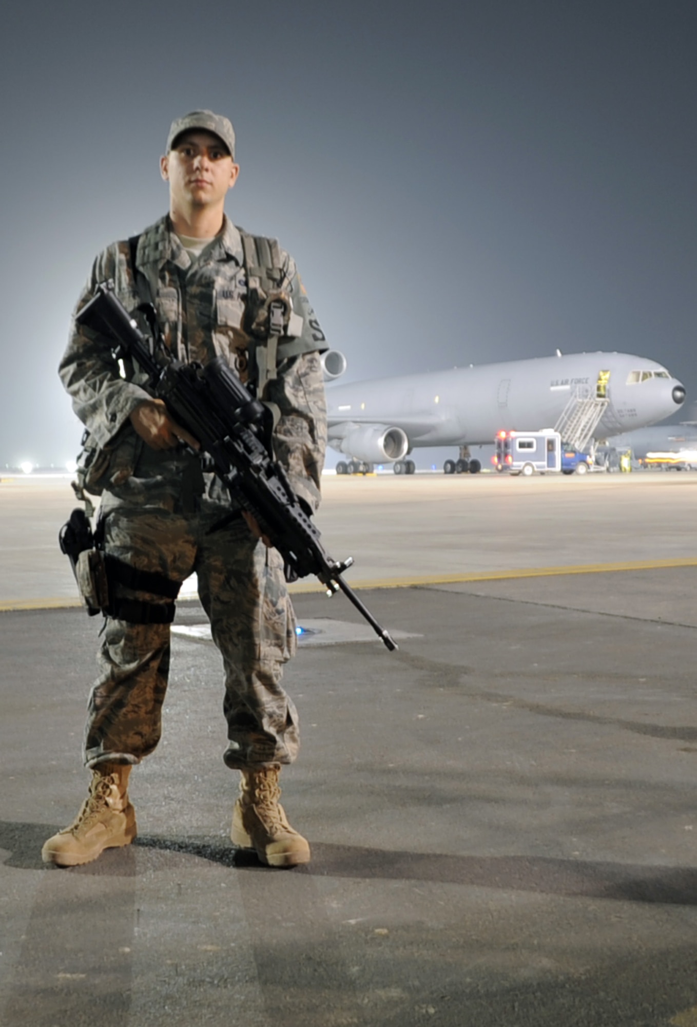 Airman 1st Class Frankie Piland, security forces journeyman with the 380th Expeditionary Security Forces Squadron, watches over the flightline at a non-disclosed base in Southwest Asia on Jan. 31, 2010. Security forces Airmen like Airman Piland are in charge of protecting and providing security for thousands of deployed service members and millions of dollars worth of deployed military assets and equipment. Airman Piland is deployed from the 628th Security Forces Squadron at Joint Base Charleston, S.C., and his hometown is Seminole, Fla.  (U.S. Air Force Photo/Master Sgt. Scott T. Sturkol/Released)