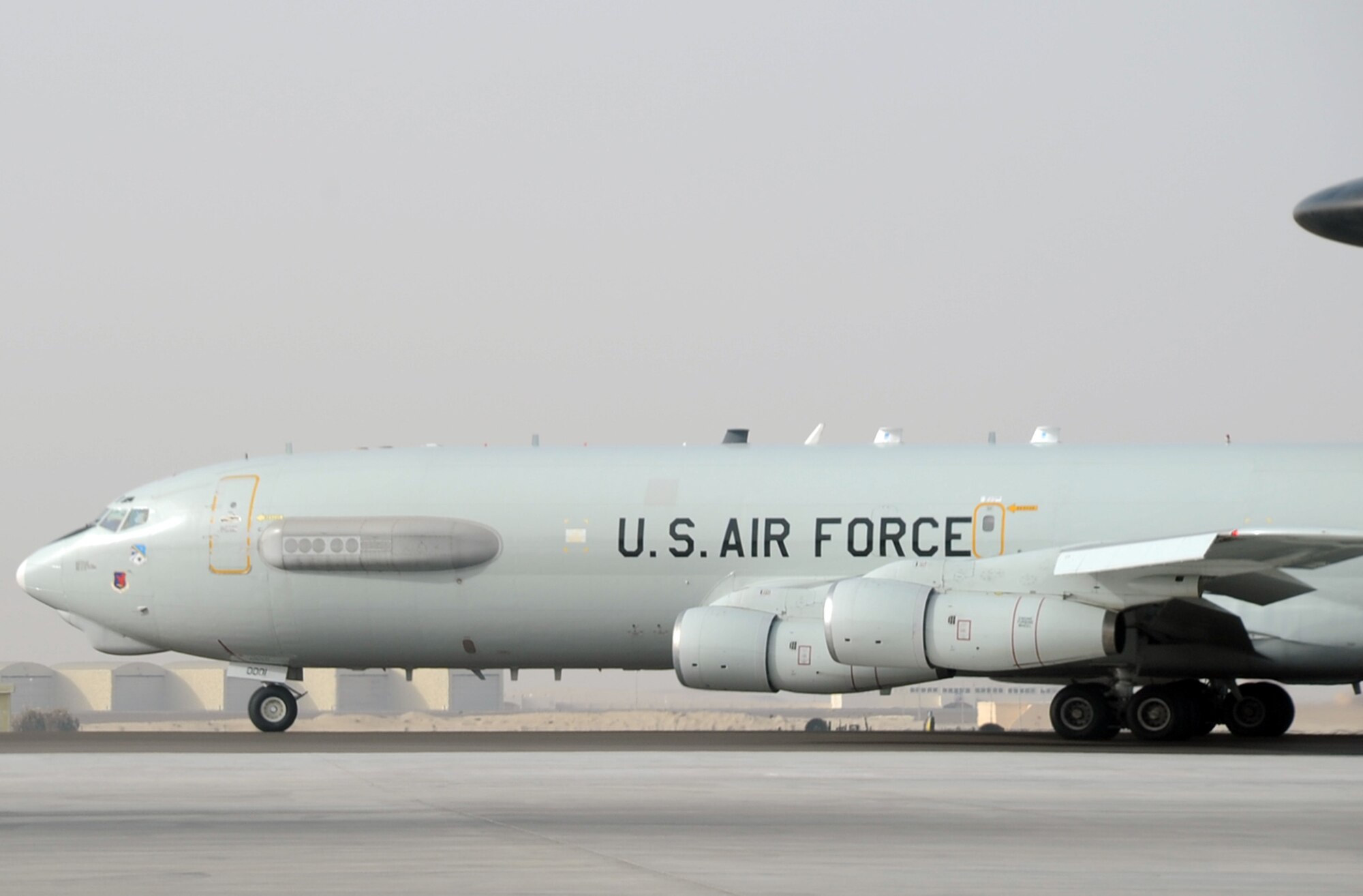 An E-3 Sentry Airborne Warning and Control System aircraft assigned to the 965th Expeditionary Airborne Air Control Squadron is guided down the runway for take-off by its flight crew en route to a combat mission during operations at a non-disclosed base in Southwest Asia on Feb. 11, 2010. The E-3 mission platform, according to its Air Force fact sheet, provides situational awareness of friendly, neutral and hostile activity, command and control of an area of responsibility, battle management of theater forces, all-altitude and all-weather surveillance of the battle space, and early warning of enemy actions during joint, allied and coalition operations. The 965th EAACS is a unit of the 380th Air Expeditionary Wing and supports operations Iraqi Freedom and Enduring Freedom and the Combined Joint Task Force-Horn of Africa. (U.S. Air Force Photo/Master Sgt. Scott T. Sturkol/Released)
