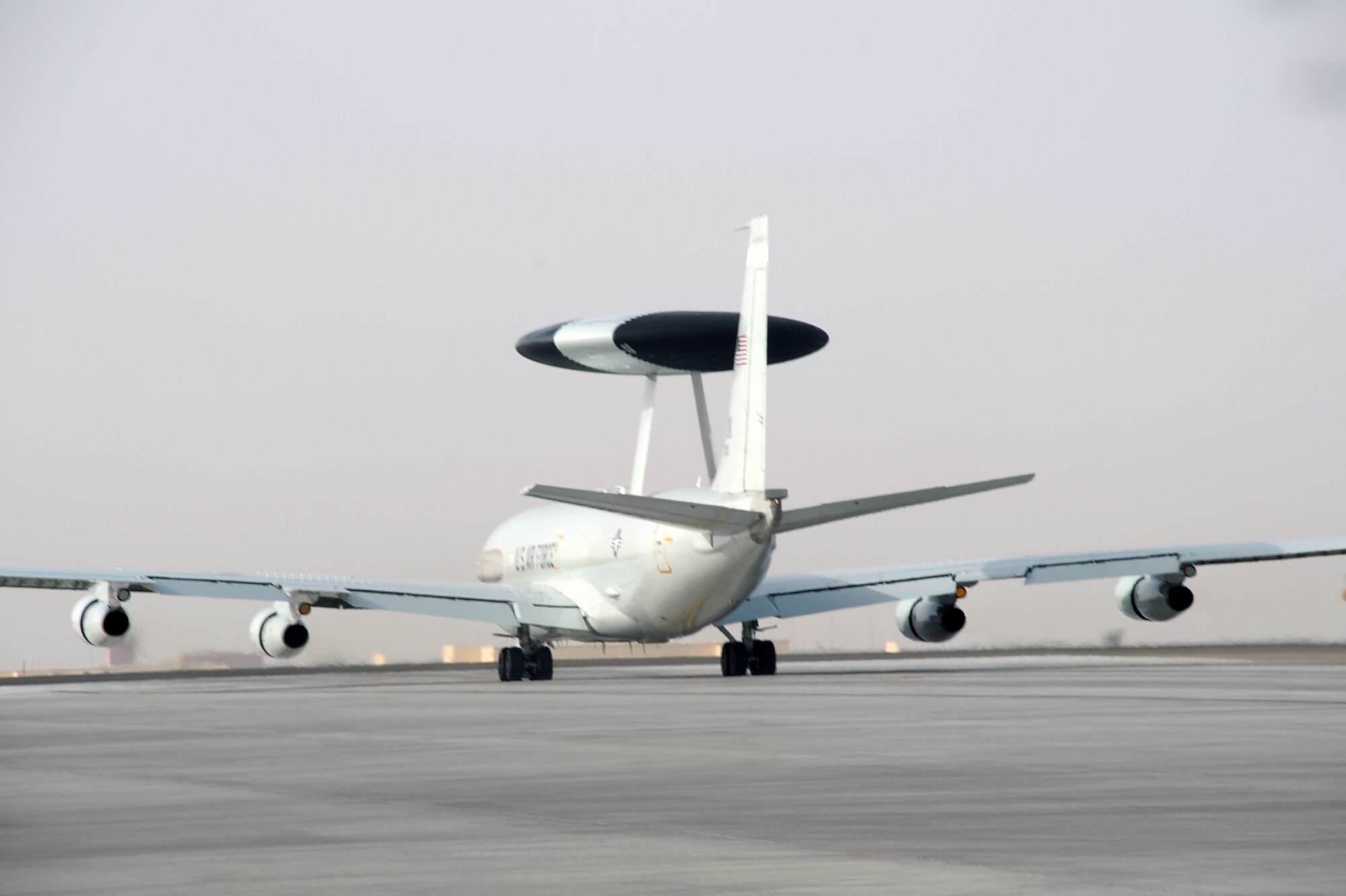 An E-3 Sentry Airborne Warning and Control System aircraft assigned to the 965th Expeditionary Airborne Air Control Squadron is guided down the runway for take-off by its flight crew en route to a combat mission during operations at a non-disclosed base in Southwest Asia on Feb. 11, 2010. The E-3 mission platform, according to its Air Force fact sheet, provides situational awareness of friendly, neutral and hostile activity, command and control of an area of responsibility, battle management of theater forces, all-altitude and all-weather surveillance of the battle space, and early warning of enemy actions during joint, allied and coalition operations. The 965th EAACS is a unit of the 380th Air Expeditionary Wing and supports operations Iraqi Freedom and Enduring Freedom and the Combined Joint Task Force-Horn of Africa. (U.S. Air Force Photo/Master Sgt. Scott T. Sturkol/Released)
