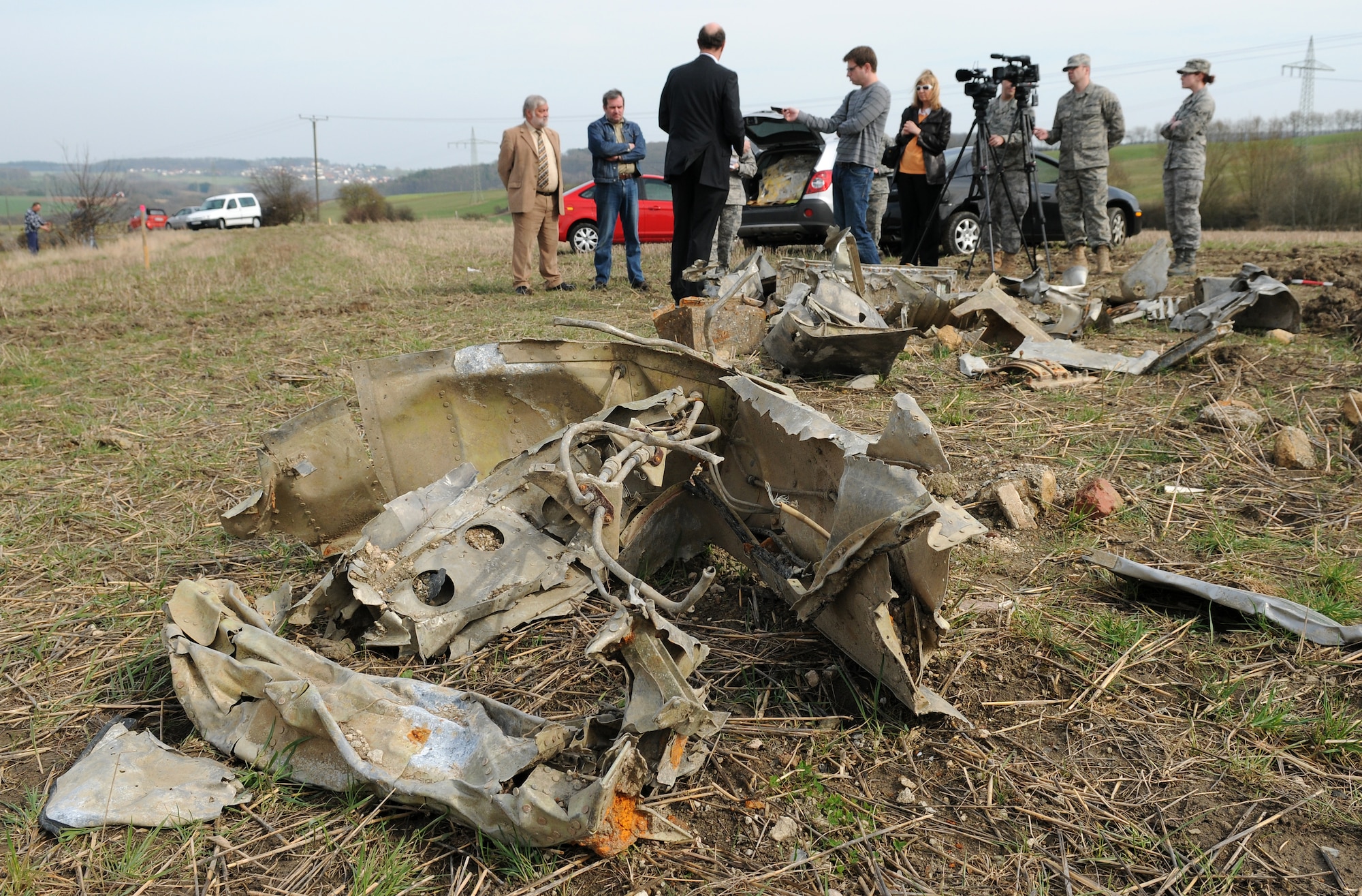 BITBURG, Germany – Rudolph Rinnen, public relations specialist for Volksbank Bitburg, answers questions about the wreckage of a P-47D Thunderbolt during a press event March 24. The wreckage was discovered Feb. 24 after being buried for 65 years. German and American reports detail that on Feb. 14, 1945, an American P-47D was shot down in the area. (U.S. Air Force photo/Senior Airman Nathanael Callon)