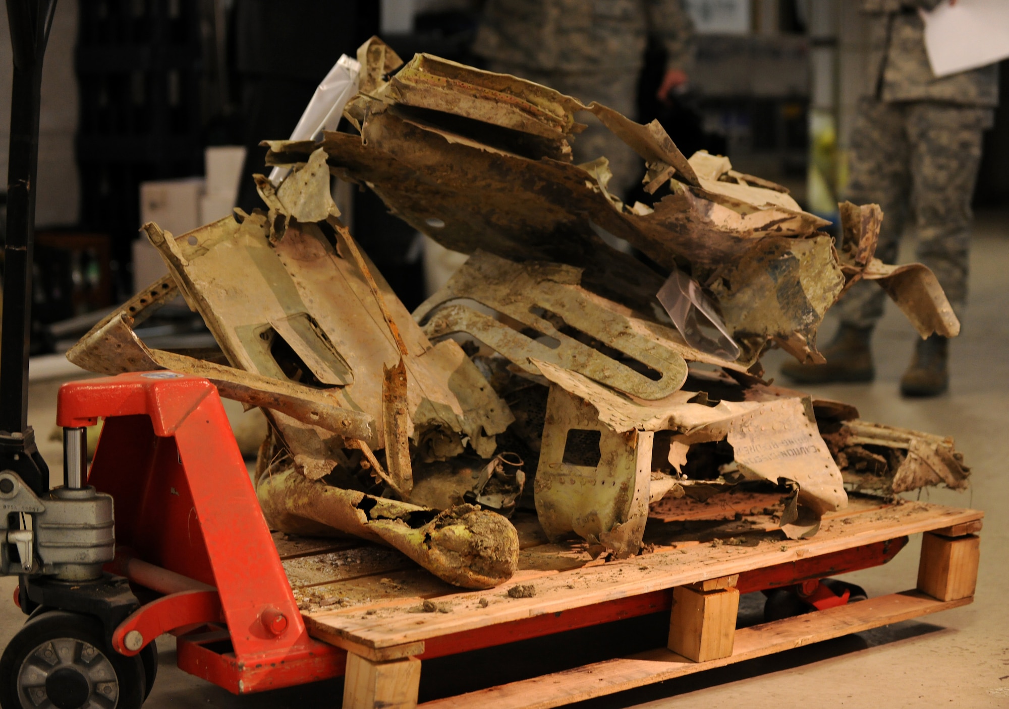 BITBURG, Germany – Wreckage of a P-47D Thunderbolt sits on a pallet during a press event at Volksbank Bitburg March 24. The plane was discovered on Feb. 24 in Bitburg, 65 years after it crashed in the area. (U.S. Air Force photo/Senior Airman Nathanael Callon)
