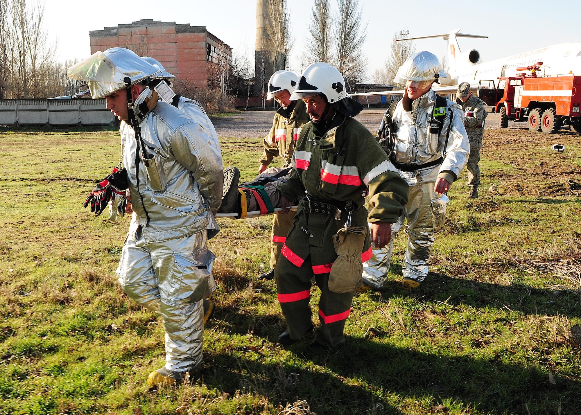 376th Air Expeditionary Wing personnel and Manas International Airport personnel participated in a Major Accident Response Exercise at the Transit Center at Manas, Kyrgyzstan, March 25, 2010.  Exercise participants included members of the MIA fire department and multiple agencies throughout the wing including the fire department, medical group, security forces, command post, aircraft maintenance, public affairs, legal, safety, mortuary affairs, chaplain, fuels, transportation, contracting, finance, air traffic control and civil engineering. (U.S. Air Force photo/Senior Airman Nichelle Anderson/released)