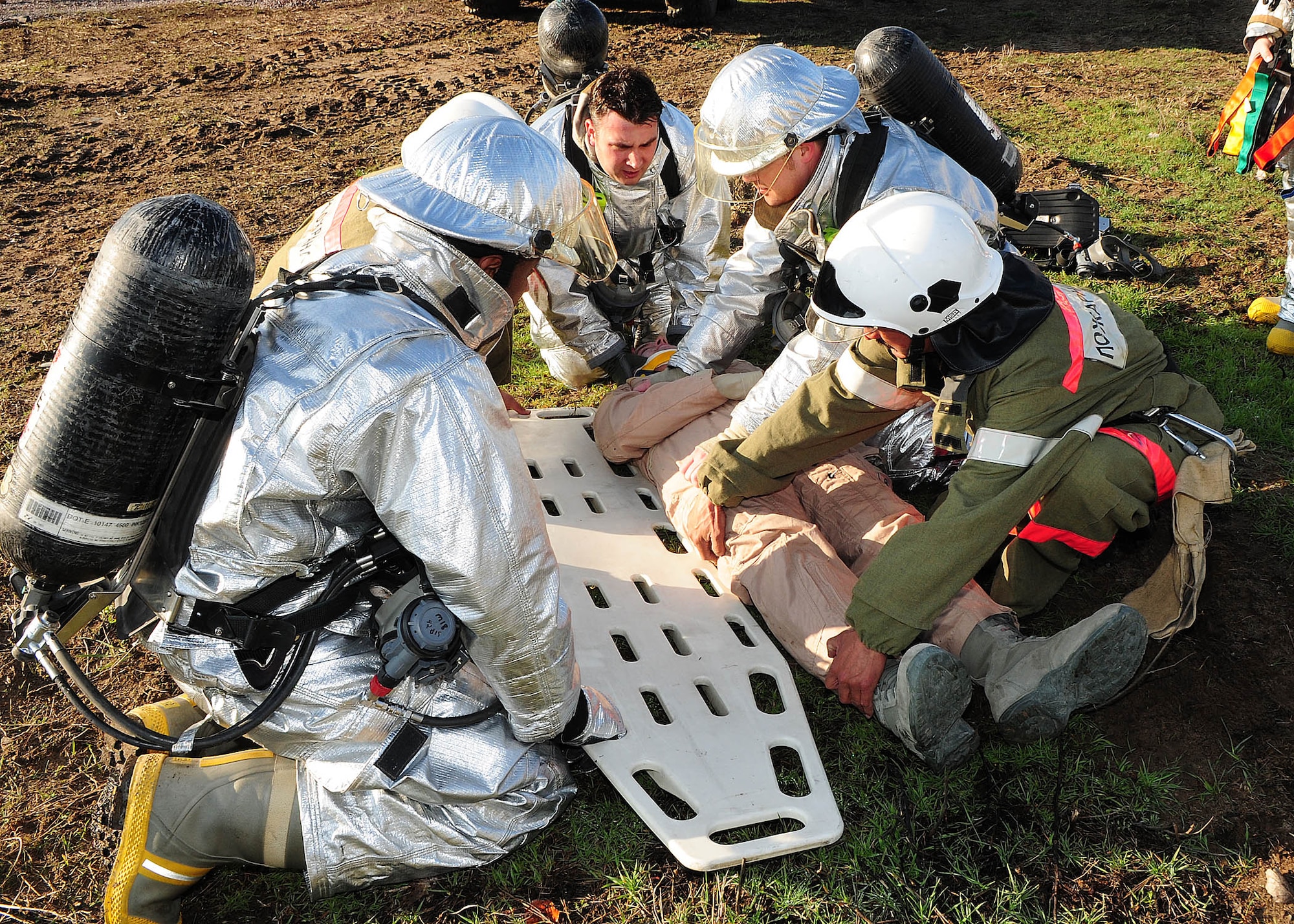 376th Air Expeditionary Wing personnel and Manas International Airport personnel participated in a Major Accident Response Exercise at the Transit Center at Manas, Kyrgyzstan, March 25, 2010.  Exercise participants included members of the MIA fire department and multiple agencies throughout the wing including the fire department, medical group, security forces, command post, aircraft maintenance, public affairs, legal, safety, mortuary affairs, chaplain, fuels, transportation, contracting, finance, air traffic control and civil engineering. (U.S. Air Force photo/Senior Airman Nichelle Anderson/released)