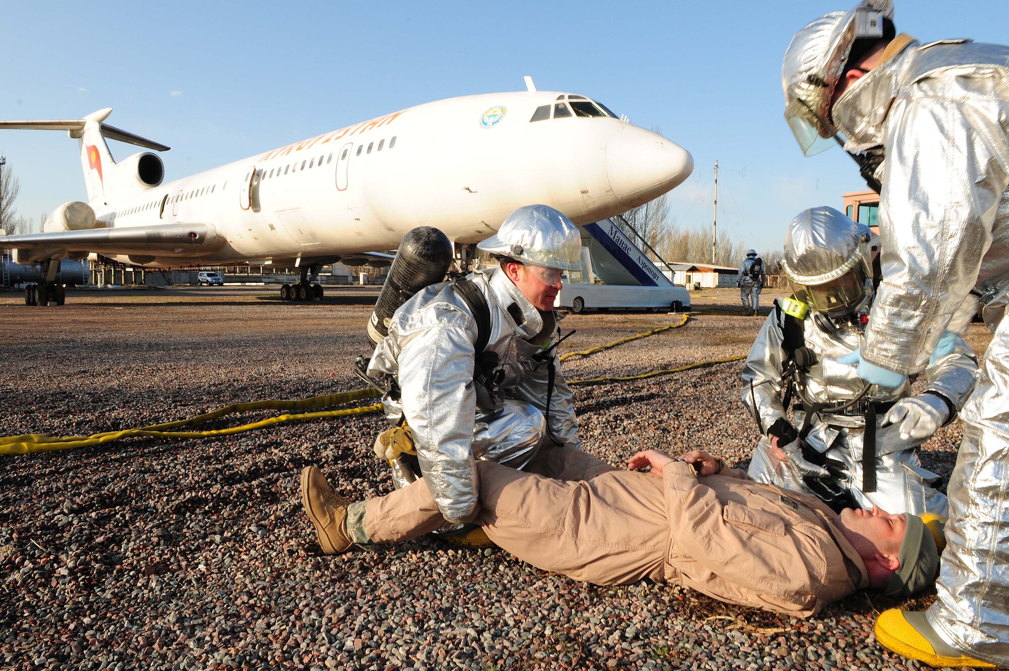 376th Air Expeditionary Wing personnel and Manas International Airport personnel participated in a Major Accident Response Exercise at the Transit Center at Manas, Kyrgyzstan, March 25, 2010.  Exercise participants included members of the MIA fire department and multiple agencies throughout the wing including the fire department, medical group, security forces, command post, aircraft maintenance, public affairs, legal, safety, mortuary affairs, chaplain, fuels, transportation, contracting, finance, air traffic control and civil engineering. (U.S. Air Force photo/Senior Airman Nichelle Anderson/released)