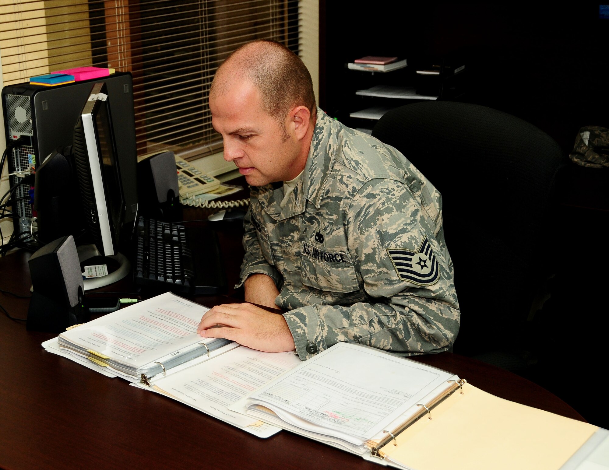 ANDERSEN AIR FORCE BASE, Guam- Tech. Sgt  Robbie Romines, Weapons Safety NCO assigned to the 36th Wing, checks a procedural guidance, here March 19. Sergeant Romines was recently recognized as a 'Top Performer' by the 36th Wing Staff First Sergeant. (U.S. Air Force photo by Airman 1st Class Jeffrey Schultze)
