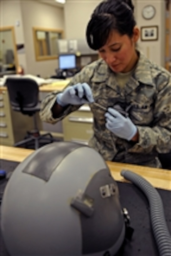 U.S. Air Force Senior Airman Jennifer Lopez, a 37th Bomb Squadron aircrew flight equipment technician, performs a routine inspection on a helmet to check for defects at Ellsworth Air Force Base, S.D., on March 22, 2010.  Aircrew flight equipment personnel inspect all aircrew equipment and survival gear before it is used.  