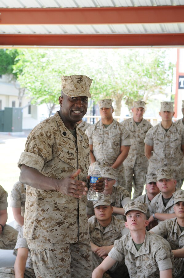 Sgt. Maj. of the Marine Corps Carlton Kent speaks to Marines at the Marine Corps Air Station in Yuma, Ariz., March 26, 2010. Kent and the Commandant of the Marine Corps Gen. James Conway visited the air station for two days as part of their West Coast tour. During his first day here, Kent answered Marines’ questions and touched on topics ranging from barracks living and Marines in Afghanistan. Kent made sure his opinion of the Marines was known. “The Commandant and I are extremely proud of what you warriors are doing,” said Kent.