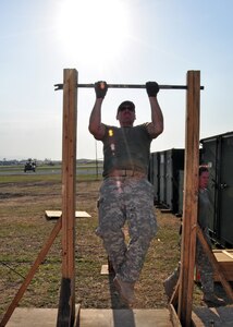 Army Sergeant Michael St. Jean, 1st Battalion, 228th Regiment, cranks out a set of pull-ups in between missions March 26 at Toussaint Louverture International Airport, Haiti. Members of Joint Task Force-Bravo deployed March 21 in support of Joint Task Force-Haiti, the U.S. military’s task force assisting in disaster relief efforts in Haiti following the Jan. 12 earthquake as part of Operation Unified Response. (U.S. Air force photo/Staff Sgt. Bryan Franks)
