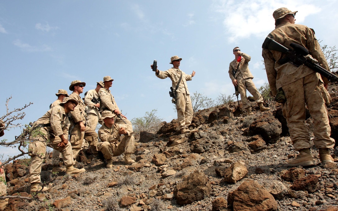 1st Lt. Daniel Runzheimer (center), platoon commander of Weapons platoon, Alpha Company, Battalion Landing Team 1st Battalion, 9th Marine Regiment, 24th Marine Expeditionary Unit, briefs his Marines before conducting a live fire exercise using MK153 Shoulder-fired, Multi-purpose, Assault Weapon (SMAW) on a range in Djibouti, Africa, March 28, 2010.  24th MEU Marines performed a series of sustainment exercises, as well as bi-lateral training alongside the French military, during a month-long rotation of units from 24th MEU conducting training in the east-African country.  The 24th MEU currently serves as the theatre reserve force for Central Command.  (U.S. Marine Corps photo by Gunnery Sgt. Chad R. Kiehl)