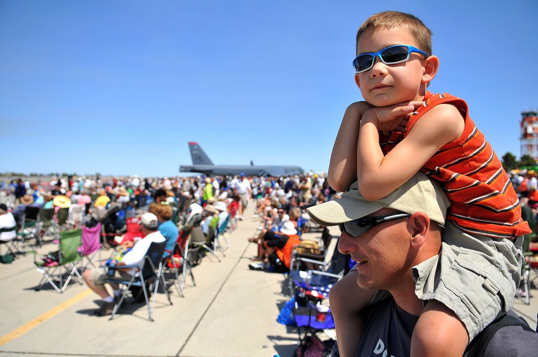 Sloan Kelley, 5, sits atop the shoulders of his father, Staff Sgt. Mike Kelley, an MV-22 Osprey crew chief instructor at Marine Aviation Weapons and Tactics Squadron 1, during the 48th annual Yuma Air Show at the Marine Corps Air Station in Yuma, Ariz., March 27, 2010. The air show attracted a crowd of approximately 20,000 spectators, including the commandant and sergeant major of the Marine Corps.
