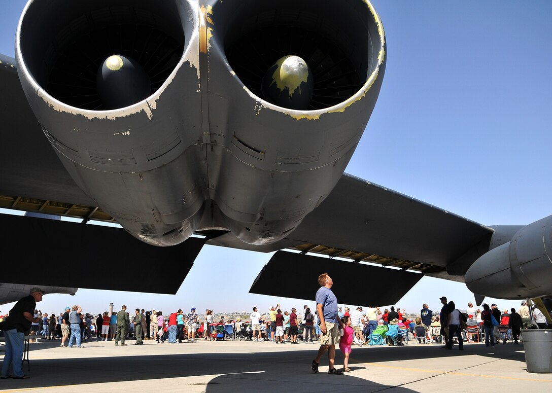 Spectators gaze up at the enormous wing of a B-52 bomber during the 48th annual Yuma Air Show at the Marine Corps Air Station in Yuma, Ariz., March 27, 2010. The air show featured several acts and nearly 50 static displays, attracting a crowd of approximately 20,000 spectators, including the commandant and sergeant major of the Marine Corps.