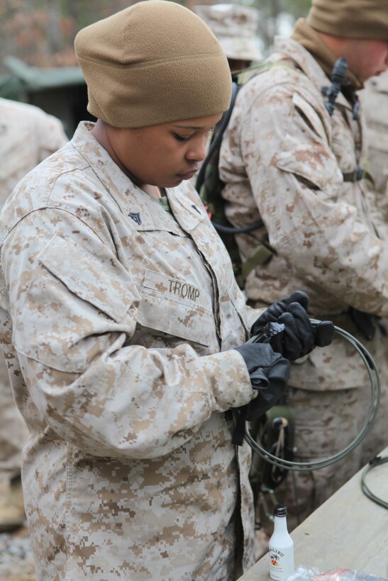 Corporal Angela M. Tromp, an administration clerk with the 26th Marine Expeditionary Unit’s Combat Logistics Battalion 26, prepares a fuse prior to a demolition exercise aboard Ft. Pickett, Va., March 30, 2010. 26th MEU, which consists of Battalion Landing Team 3/8, Combat Logistics Battalion 26, and Marine Medium Tiltrotor Squadron 266, will spend the next six months training for their upcoming deployment. (Official United States Marine Corps Photo by Lance Cpl.  Santiago G. Colon Jr.) (Released)::r::::n::