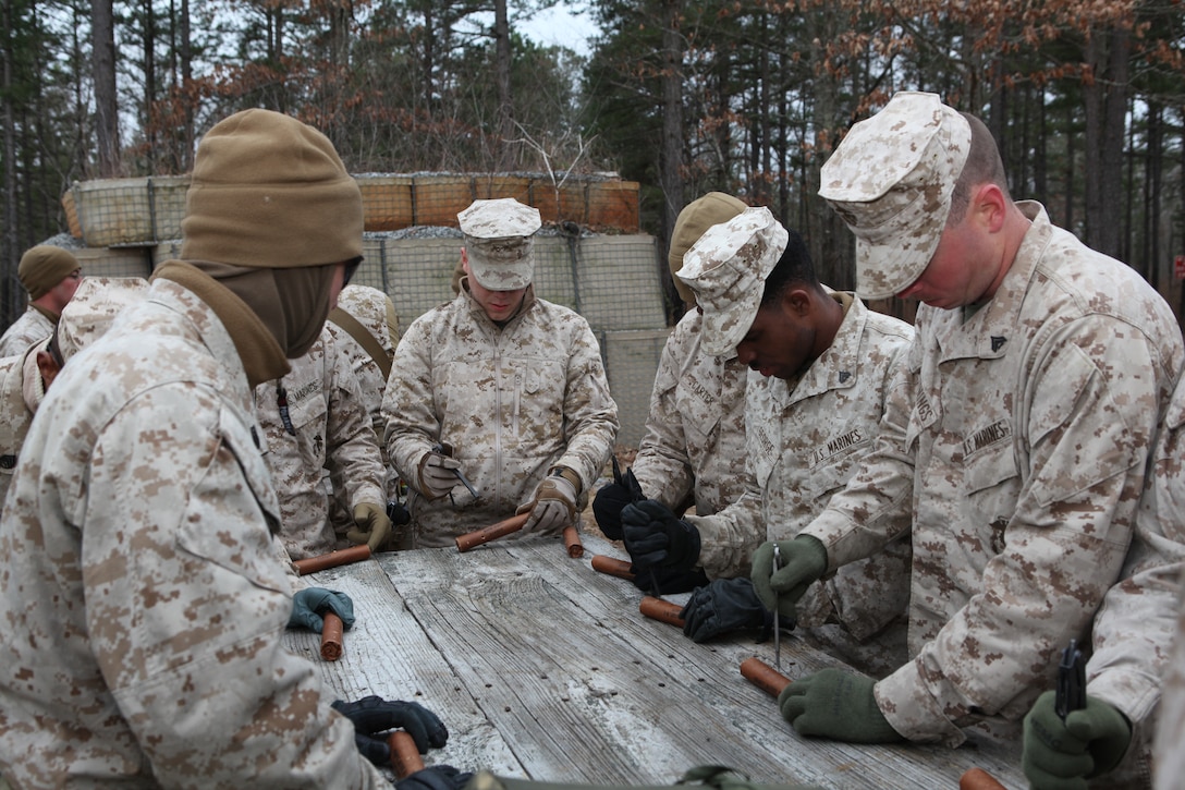 Explosive Ordinance Disposal and Combat Engineer Marines from 26th Marine Expeditionary Unit’s Combat Logistics Battalion 26 prepare their explosives prior to a demolition exercise aboard Ft. Pickett, Va., March 30, 2010. 26th MEU, which consists of Battalion Landing Team 3/8, Combat Logistics Battalion 26, and Marine Medium Tiltrotor Squadron 266, will spend the next six months training for their upcoming deployment. (Official United States Marine Corps Photo by Lance Cpl.  Santiago G. Colon Jr.) (Released)::r::::n::::r::::n::