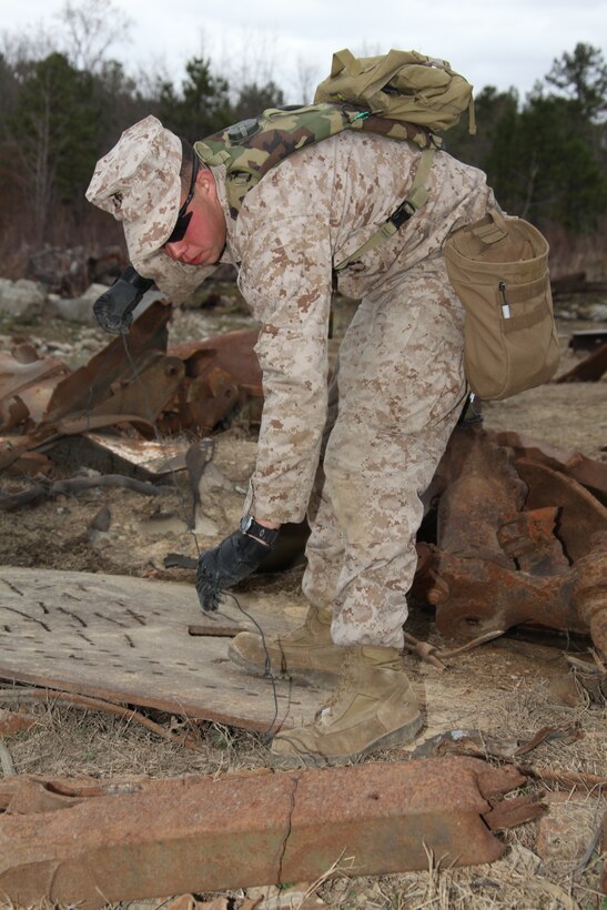 Sergeant Samuel A. Beltram, an explosive ordinance disposal technician with 26th Marine Expeditionary Unit’s Combat Logistics Battalion 26, lays a fuse prior to a demolition exercise aboard Ft. Pickett, Va., March 30, 2010. 26th MEU, which consists of Battalion Landing Team 3/8, Combat Logistics Battalion 26, and Marine Medium Tiltrotor Squadron 266, will spend the next six months training for their upcoming deployment. (Official United States Marine Corps Photo by Lance Cpl.  Santiago G. Colon Jr.) (Released)::r::::n::::r::::n::