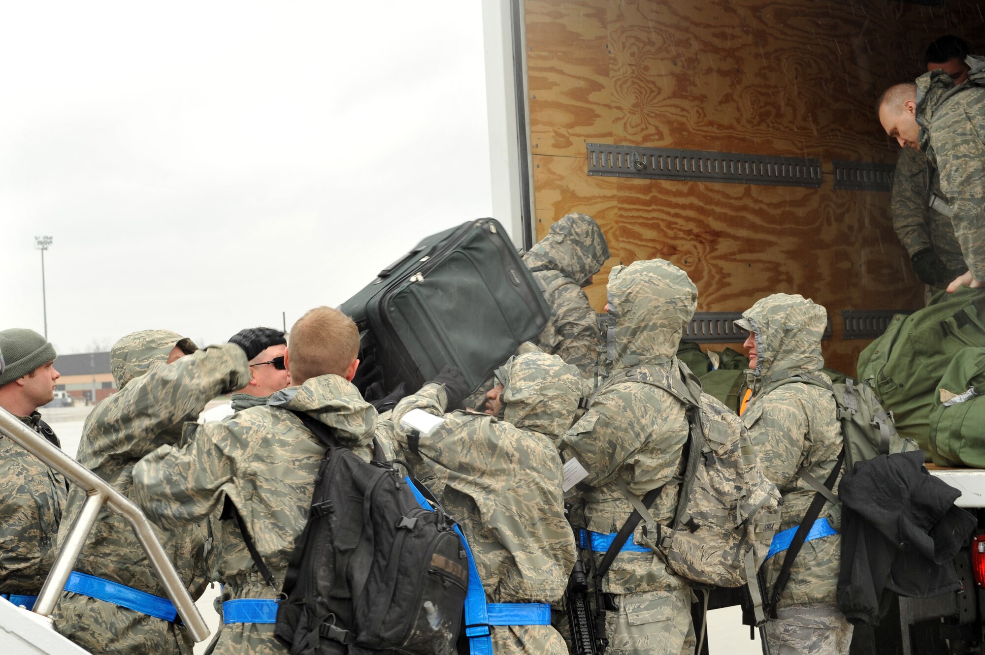 SCOTT AIR FORCE BASE, Ill. -- Members of the 375th Air Mobility Wing unload their cargo from a KC-135 Stratotanker returning from an Operational Readiness Inspection at the Volk Field Combat Readiness and Training Center, Wis., March 28, 2010. The 375th AMW was being graded by the Air Mobility Command Inspector General to ensure they can respond to a global threat and deploy combat ready Airmen at a moment's notice. (U.S. Air Force photo by Senior Airman Teresa M. Jennings)