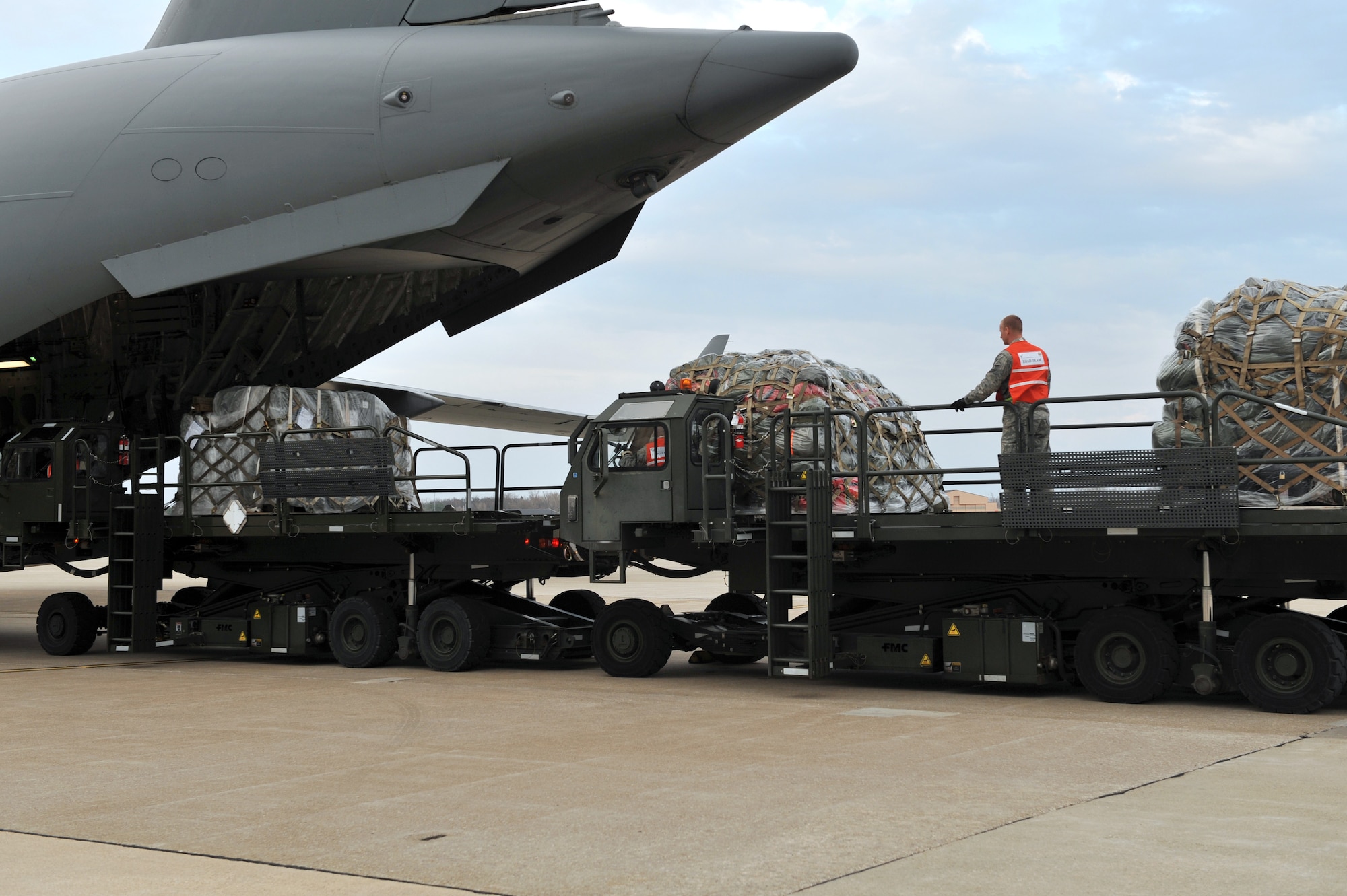 SCOTT AIR FORCE BASE, Ill. -- Members of the 375th Logistics Readiness Squadron unload pallets from a C-17A Globemaster III returning from the Volk Field Combat Readiness and Training Center, Wis., March 27, 2010. The 375th AMW was being graded by the Air Mobility Command Inspector General to ensure they are able to respond to a global threat and deploy combat ready Airmen at a moment's notice. (U.S. Air Force photo by Senior Airman Teresa M. Jennings)
