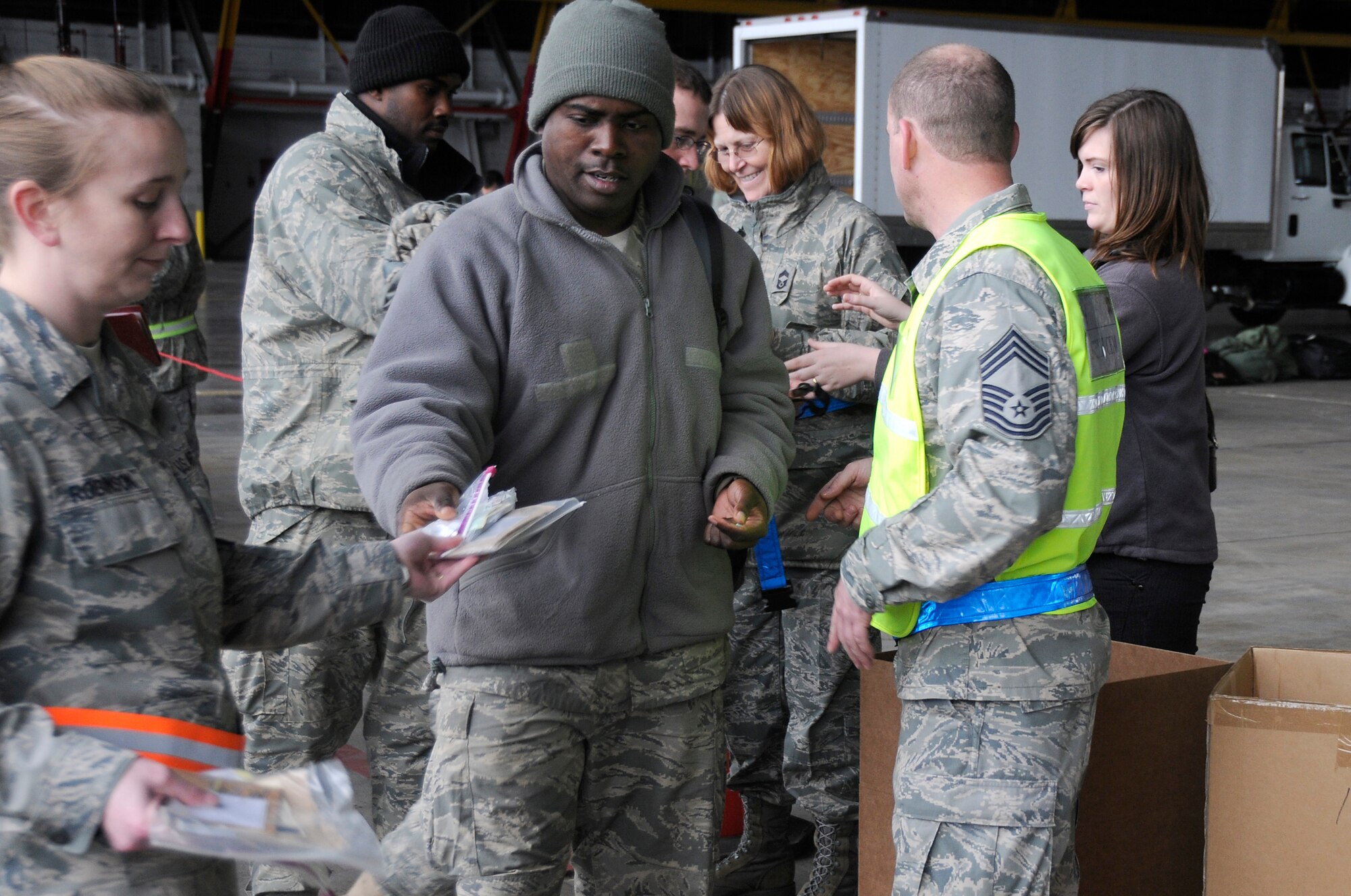 SCOTT AIR FORCE BASE, Ill. -- Airmen from the 375th Air Mobility Wing turn in their biological weapon/chemical weapon antidote kits after returning to Scott AFB from the Volk Field Combat Readiness and Training Center, Wis., as part of an Operational Readiness Inspection March 28, 2010. The ORI is done to test the wing's ability to deploy its personnel and equipment in the event of a real world incident. (U.S. Air Force photo by Staff Sgt. Brian J. Ellis)