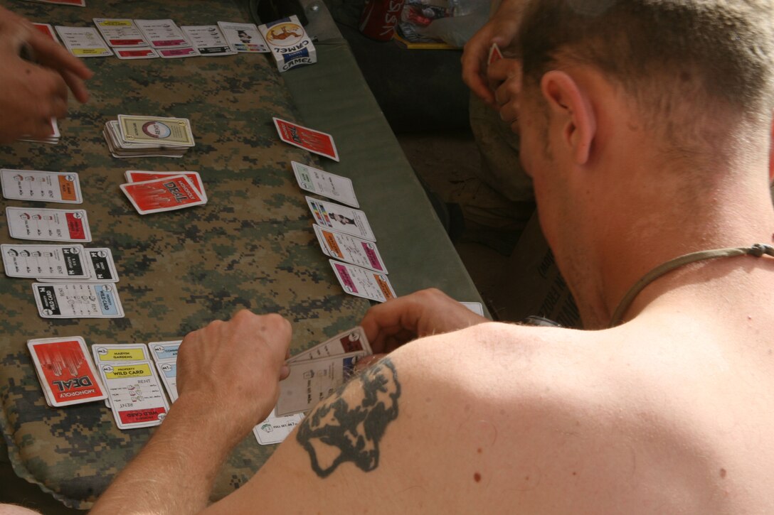 Marines play a game of cards during their down time at Forward Operating Base Marjah, March 30. The construction of the base began in early March and serves as a key center of operations within the city of Marjah, Afghanistan.