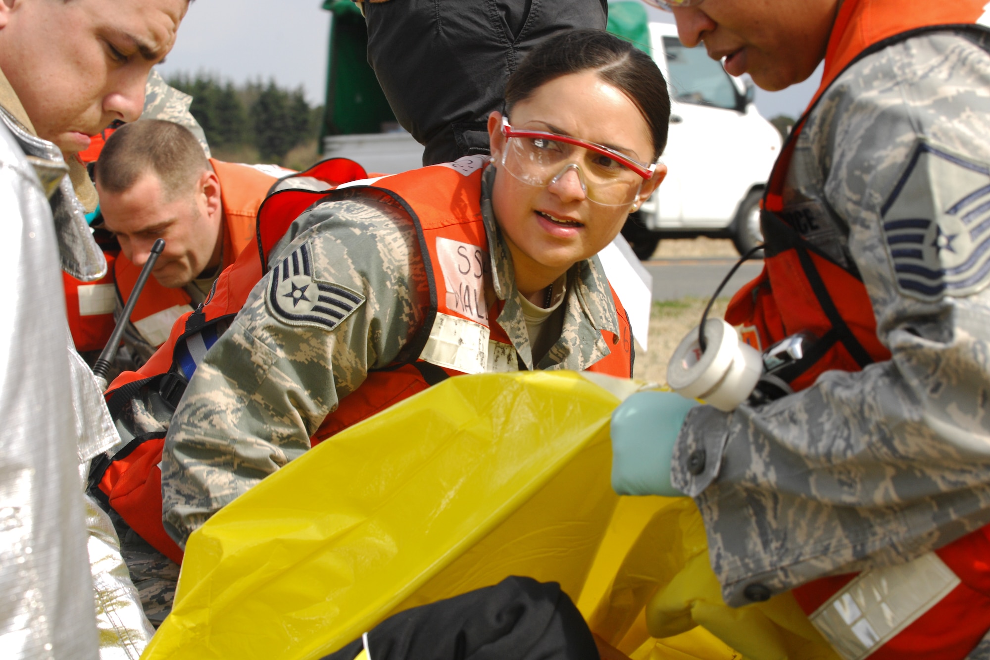 YOKOTA AIR BASE, Japan -- Staff Sgt. Carleen Wallace, 374th Medical Group, medical technician, demonstrates stabilizing a simulated vehicle accident patient during an operational readiness exercise here March 29. The exercise challenged first responders to perform initial response, casualty management, and ambulance loading procedures on victims of a simulated vehicle accident. (U.S. Air Force photo/Osakabe Yasuo)