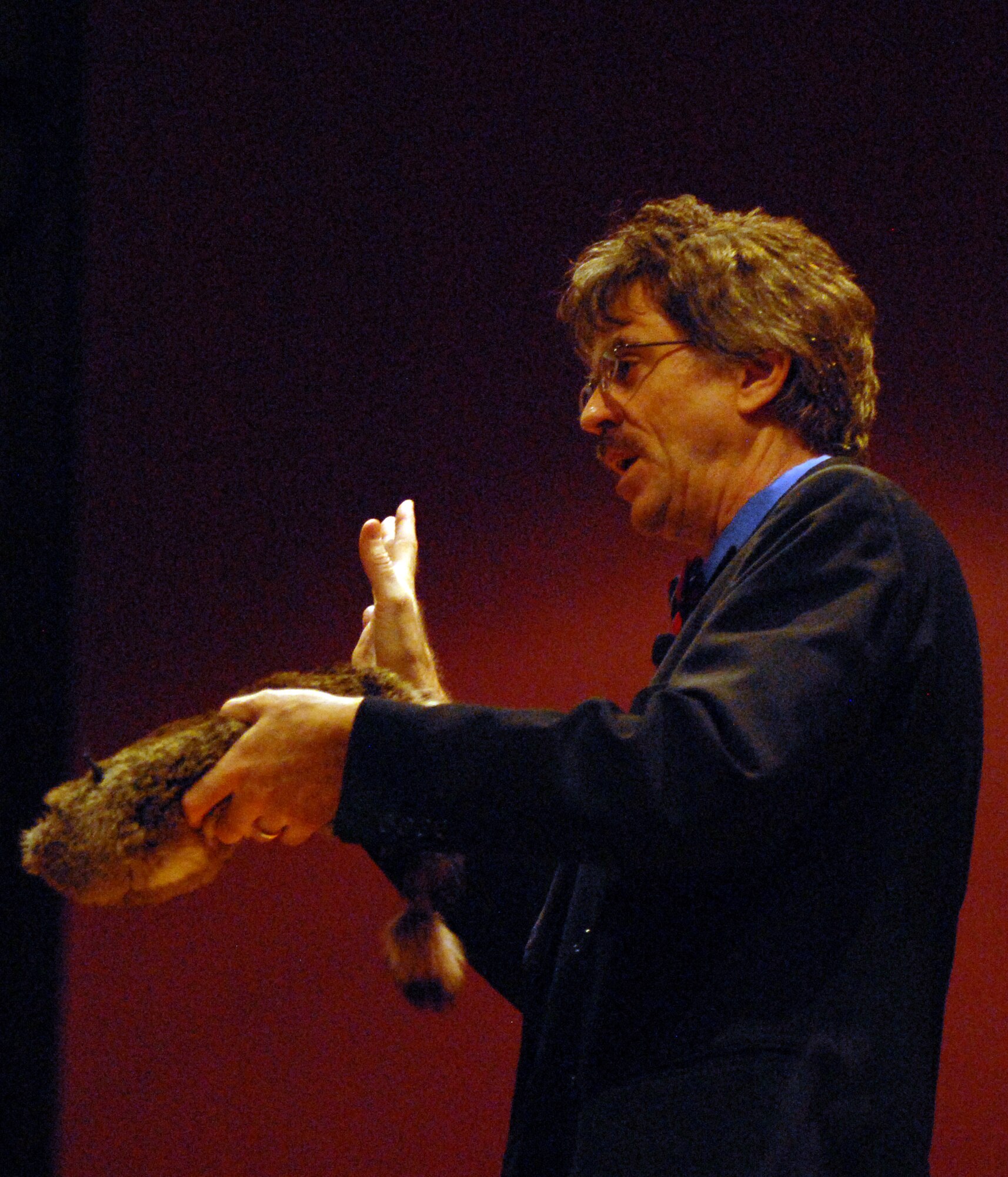VANDENBERG AIR FORCE BASE, Calif. - -Introducing the crowd to his “assistant” Rocky, magician Matt Fore performs a series of tricks making the stuffed raccoon seem lifelike for the audience here Sunday, March 28, 2010.  Even though he has performed for millions across the nation, Mr. Fore said, “Even now I am still learning.” (U.S. Air Force photo/Airman 1st Class Angelina Drake)