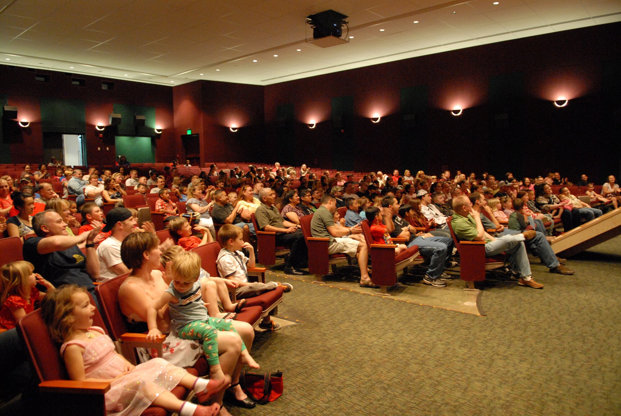 VANDENBERG AIR FORCE BASE, Calif. -- With the promise of a magic show, the base theater was brimming with parents and their children anxious to watch magician Matt Fore here Sunday, March 28, 2010. Having practiced magic since the age of 12, Matt Fore has performed both on stage and on national television. (U.S. Air Force photo/Airman 1st Class Angelina Drake)